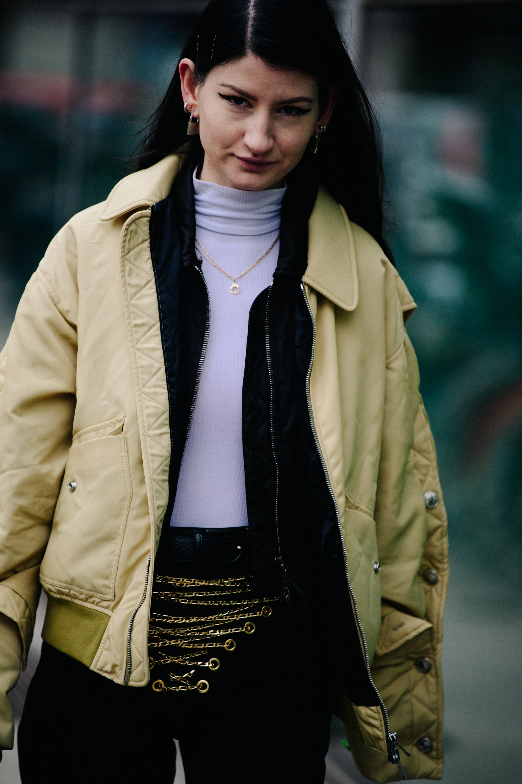 British girl wearing yellow bomber jacket