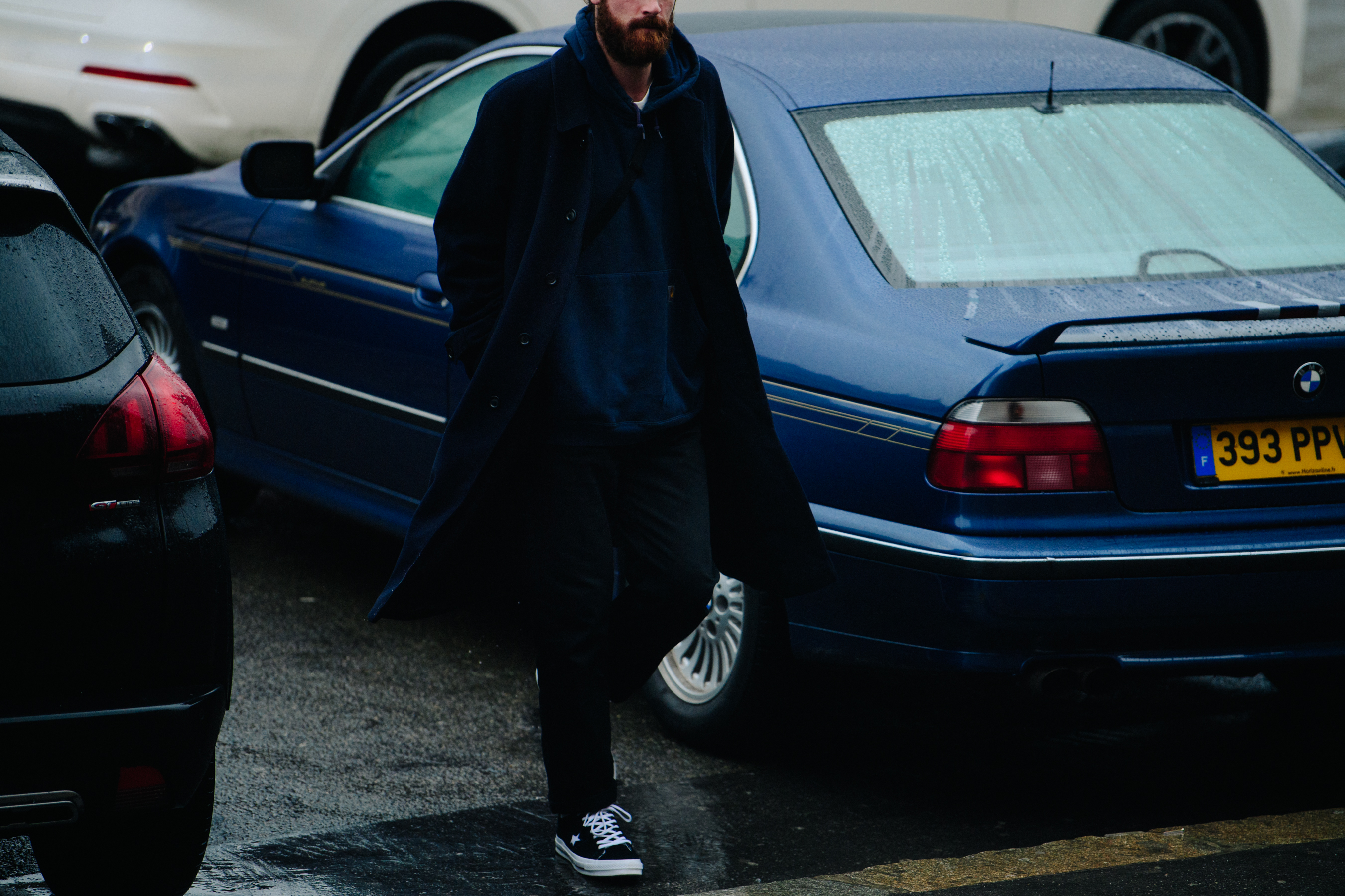 British man wearing Converse sneakers