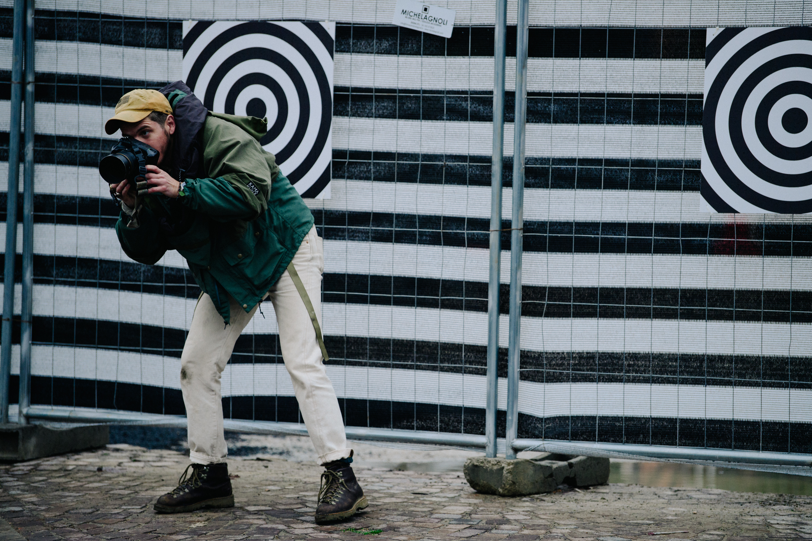 American photographer wearing green jacket
