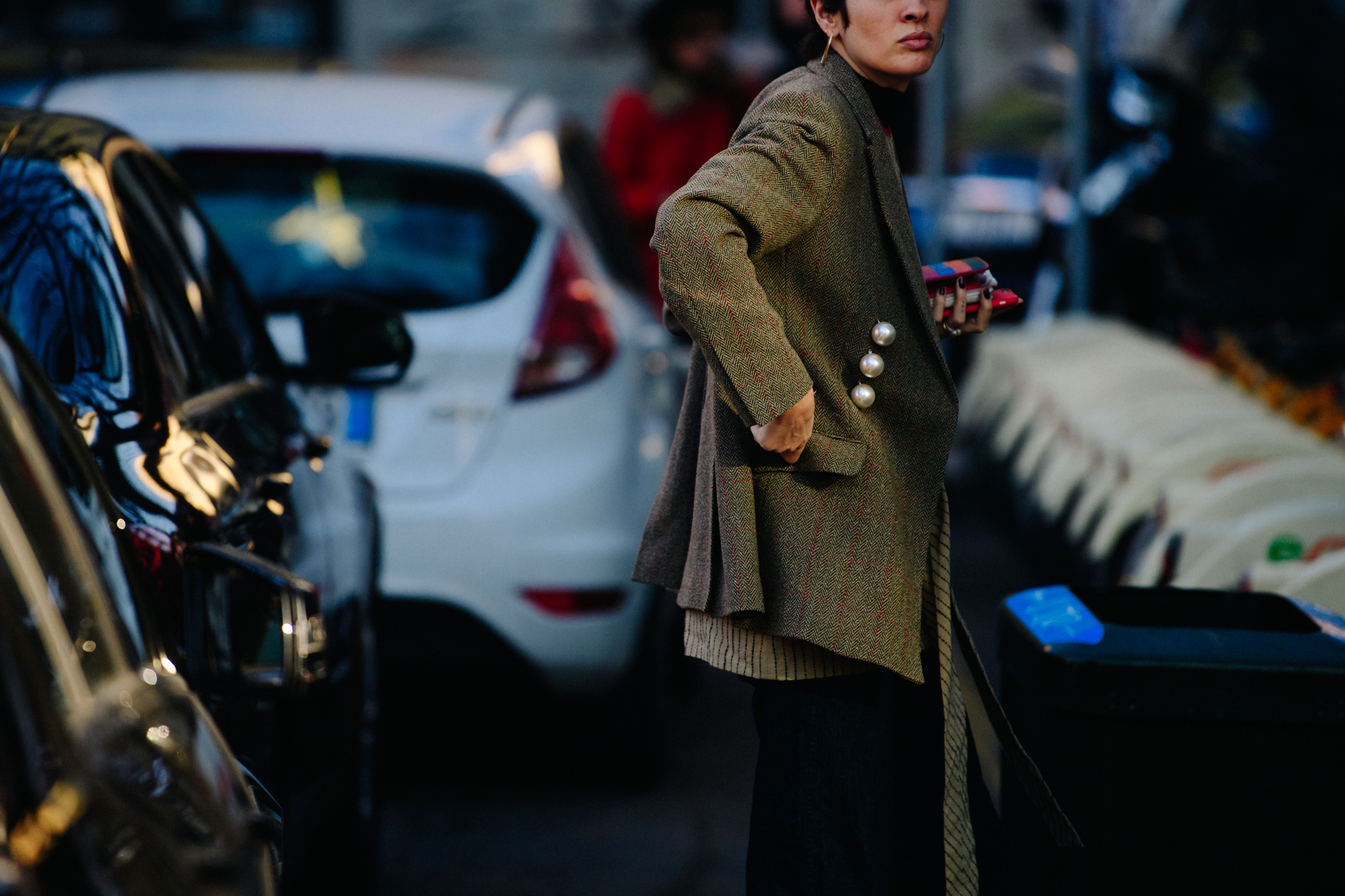 Woman wearing herringbone jacket