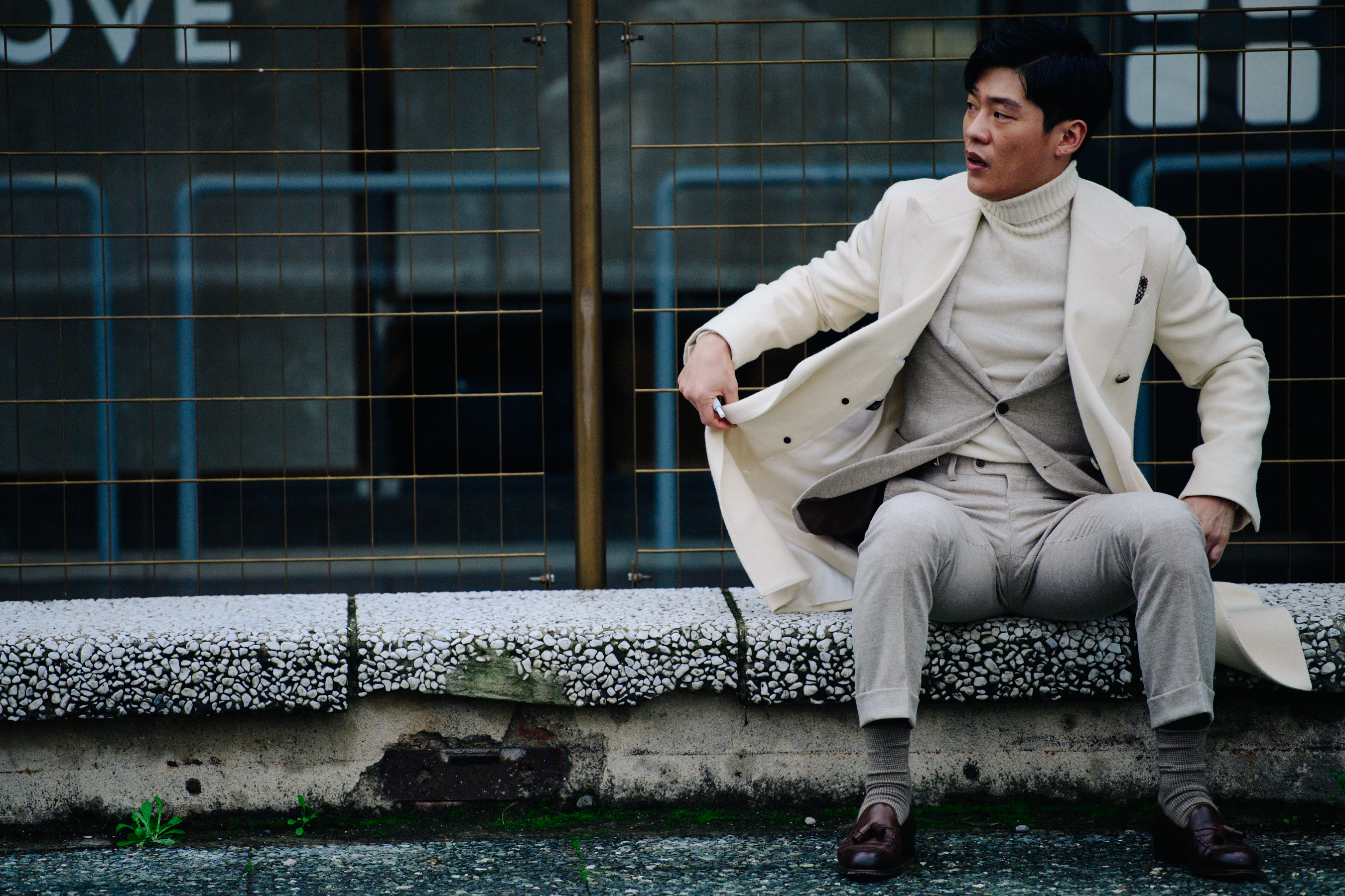 Asian man in pale linen suit