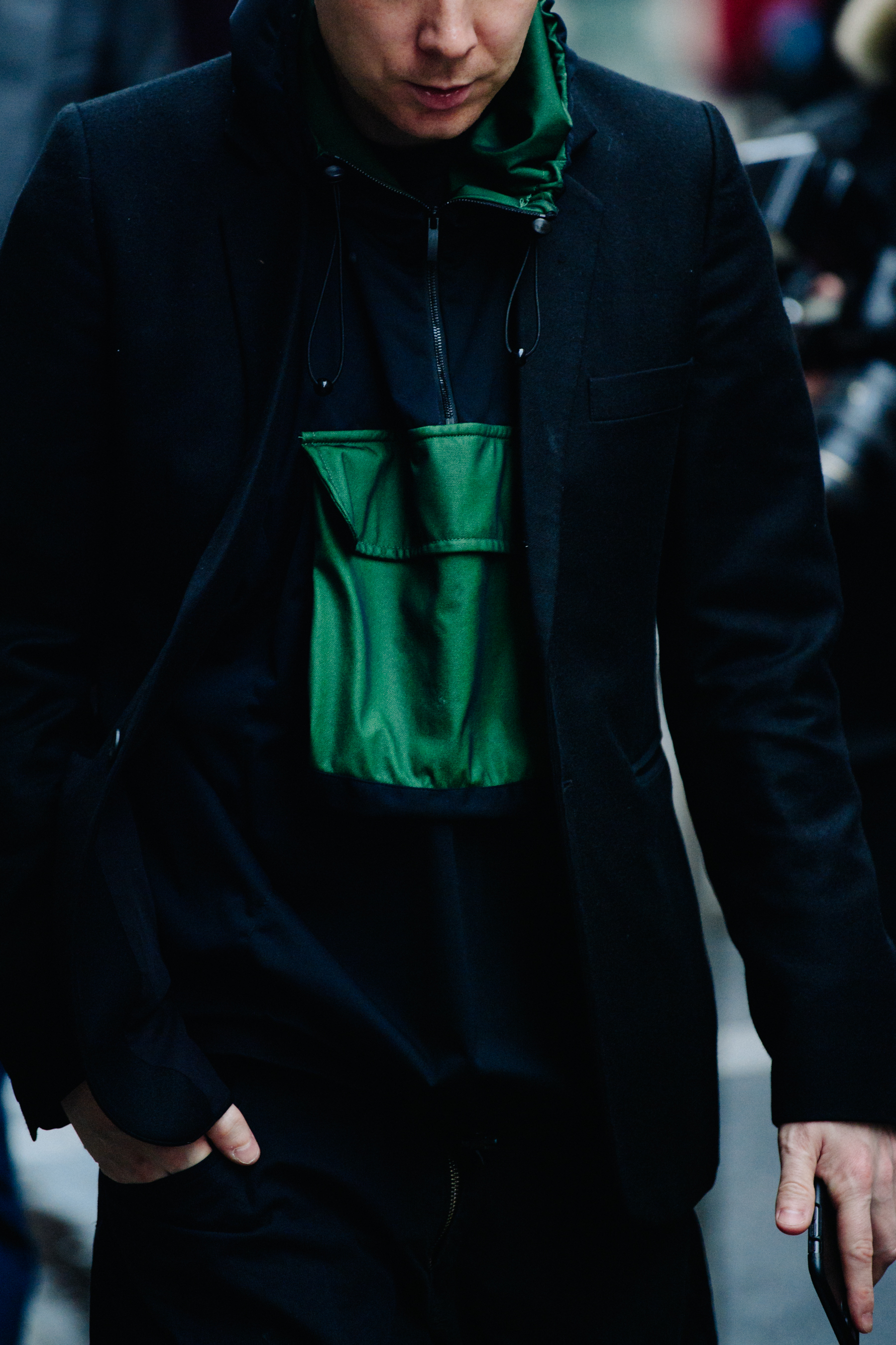 Man wearing green lined hood