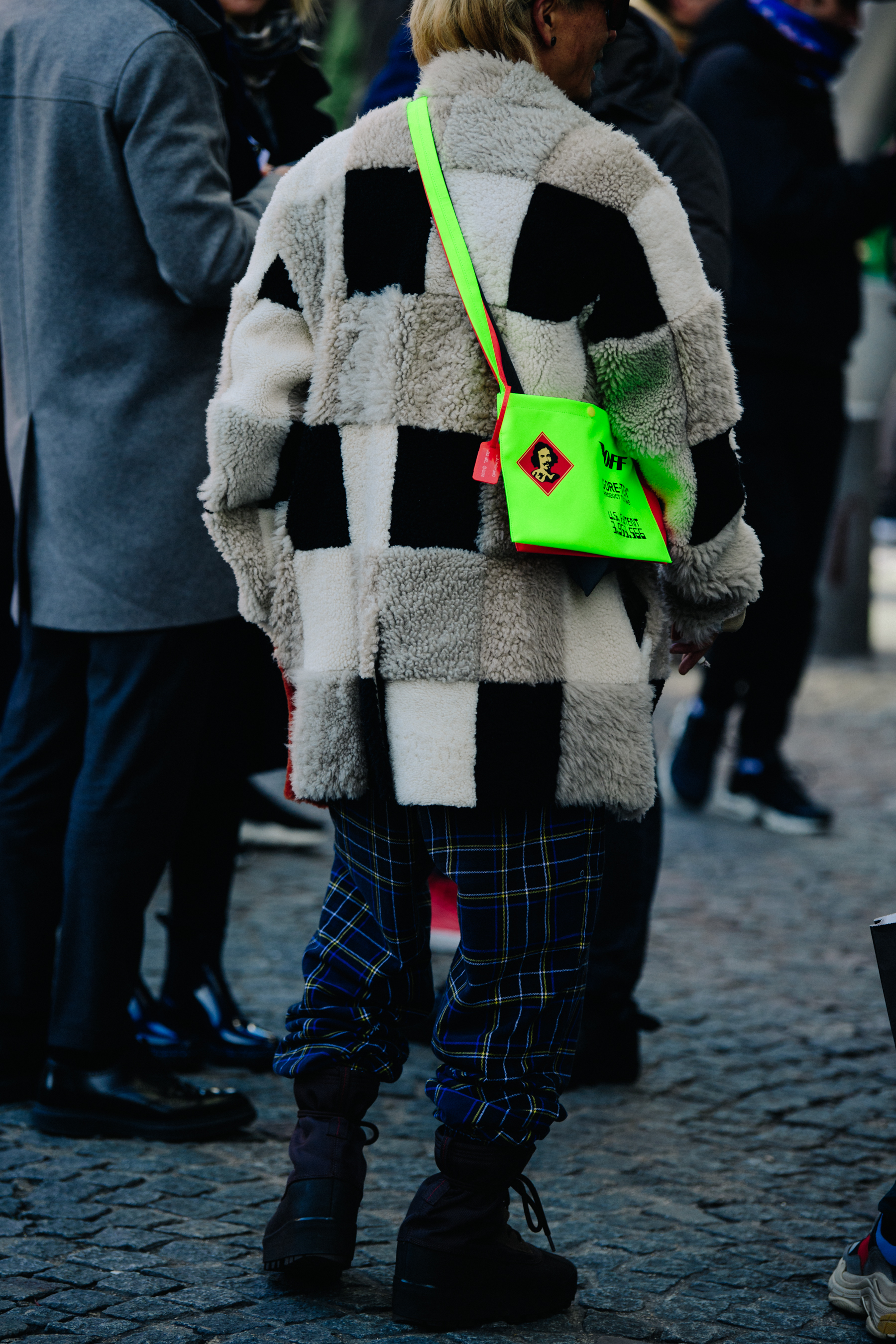Man wearing green Off-White bag