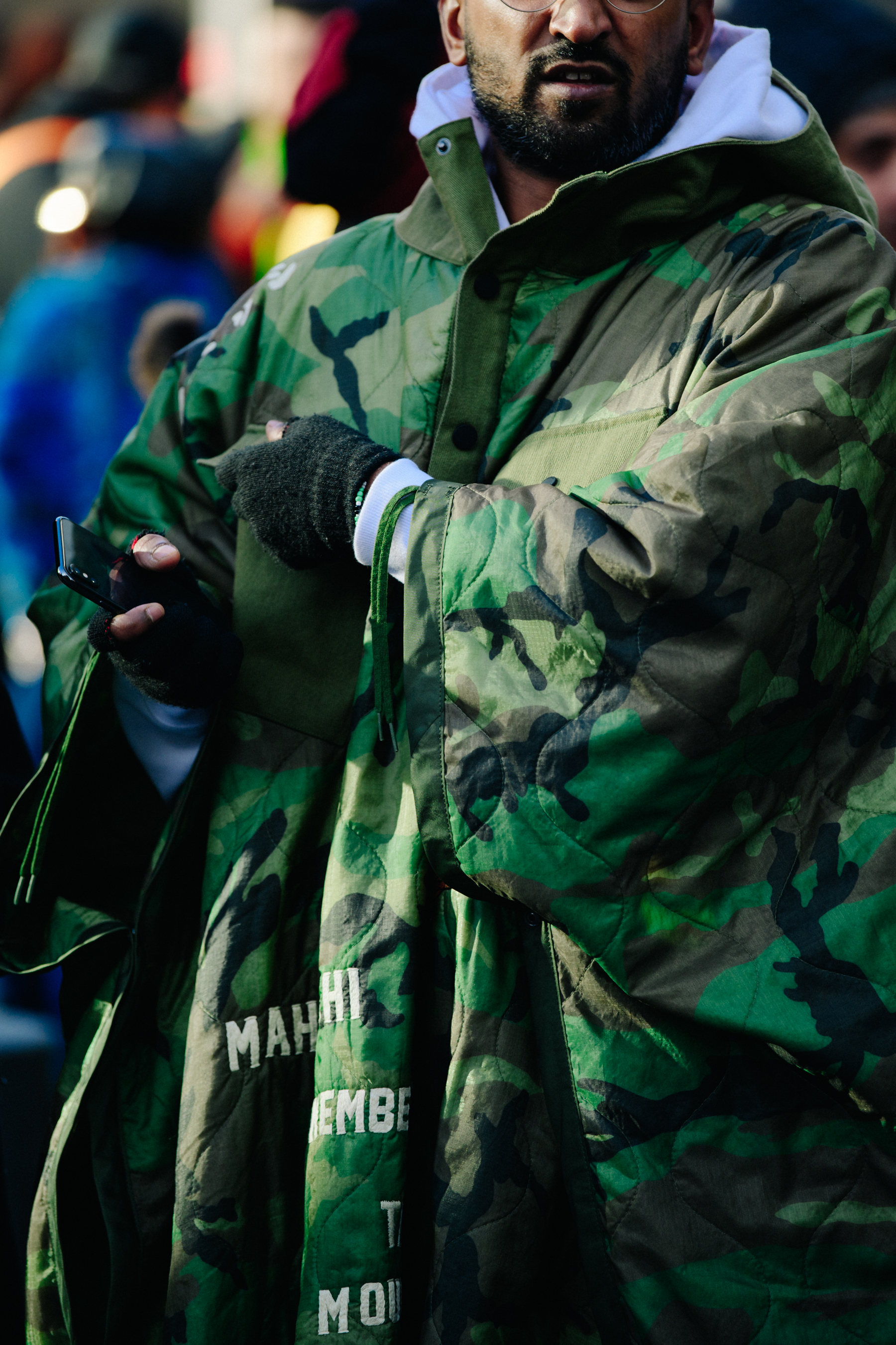 Man wearing Maharishi poncho