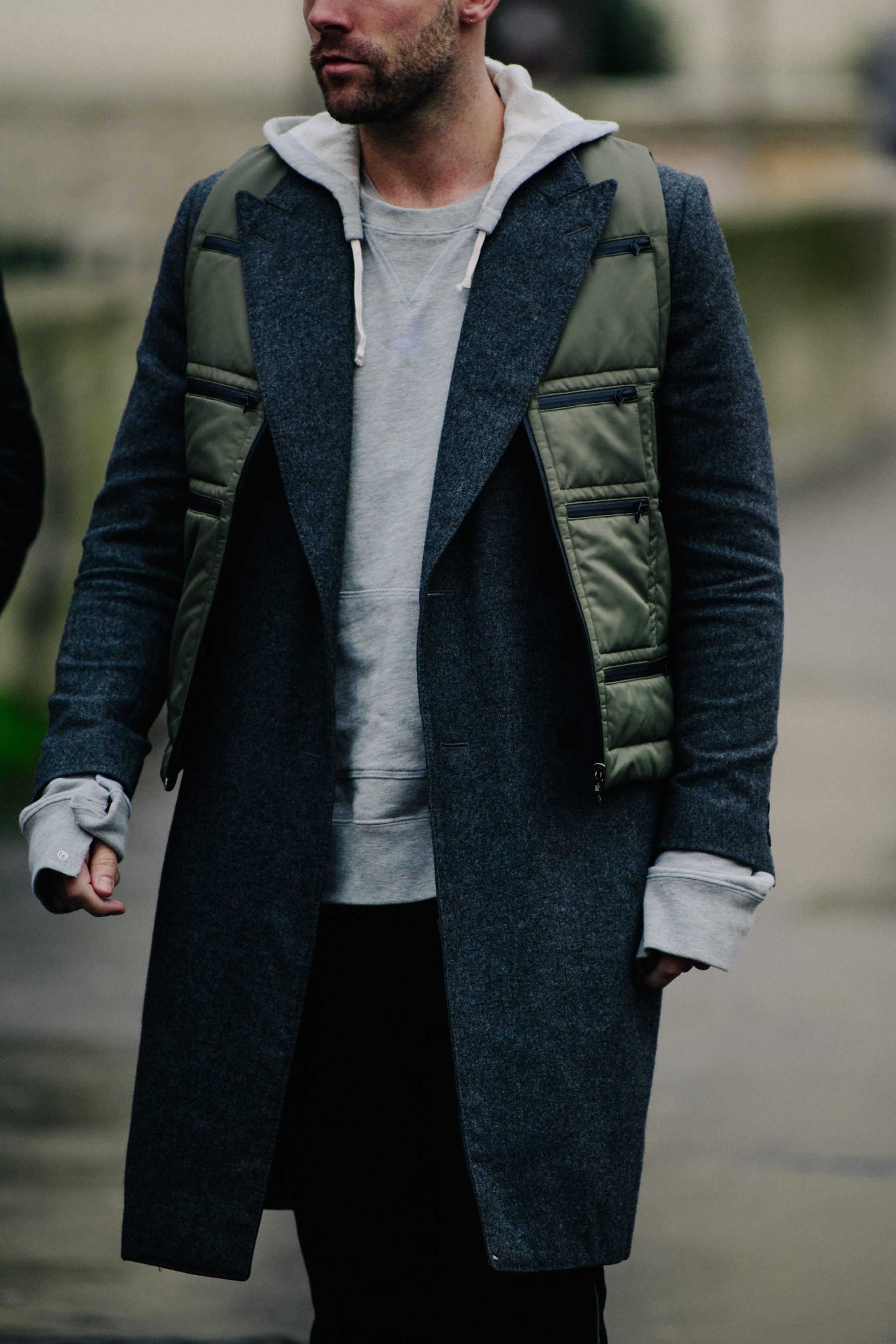 Man wearing green military vest