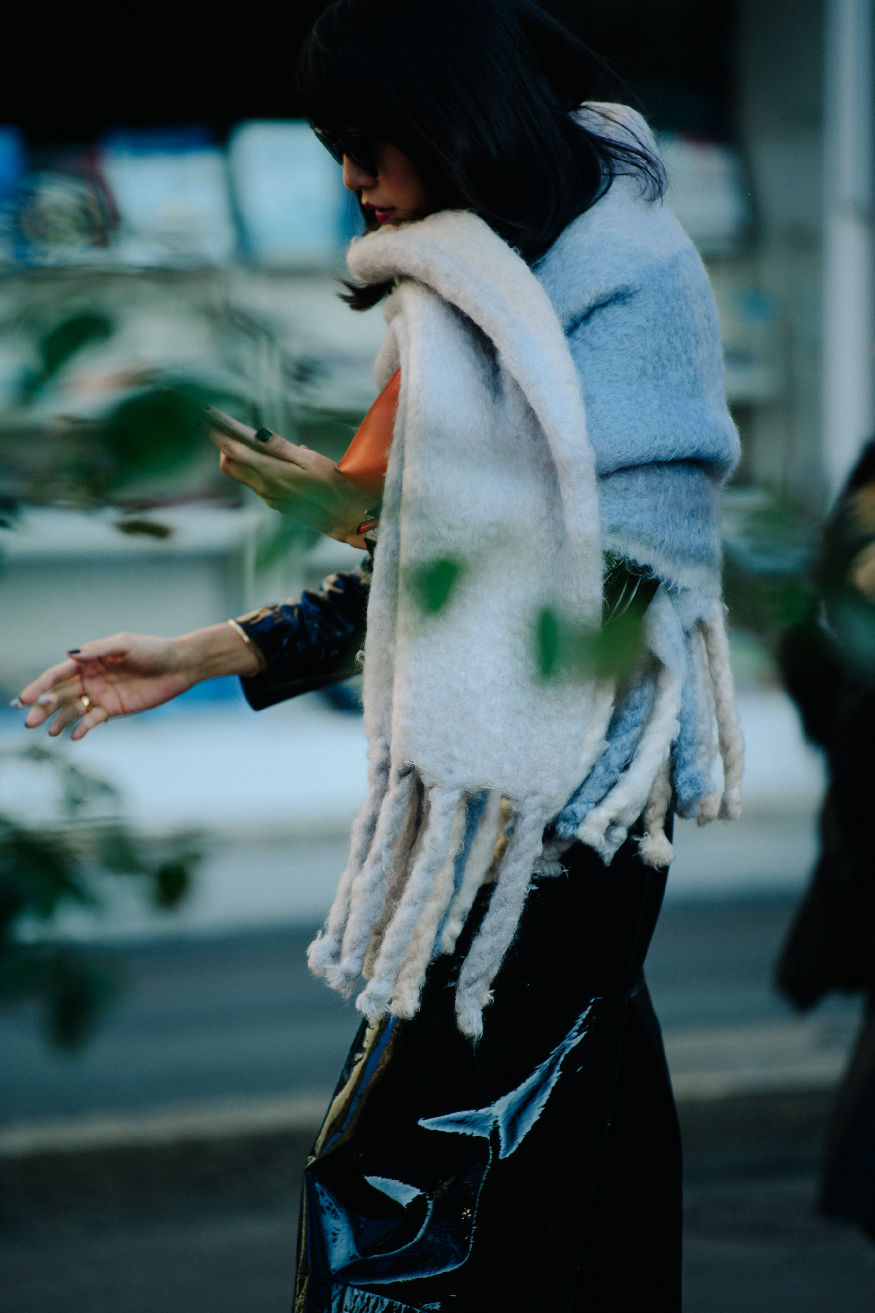 Asian woman with large grey scarf
