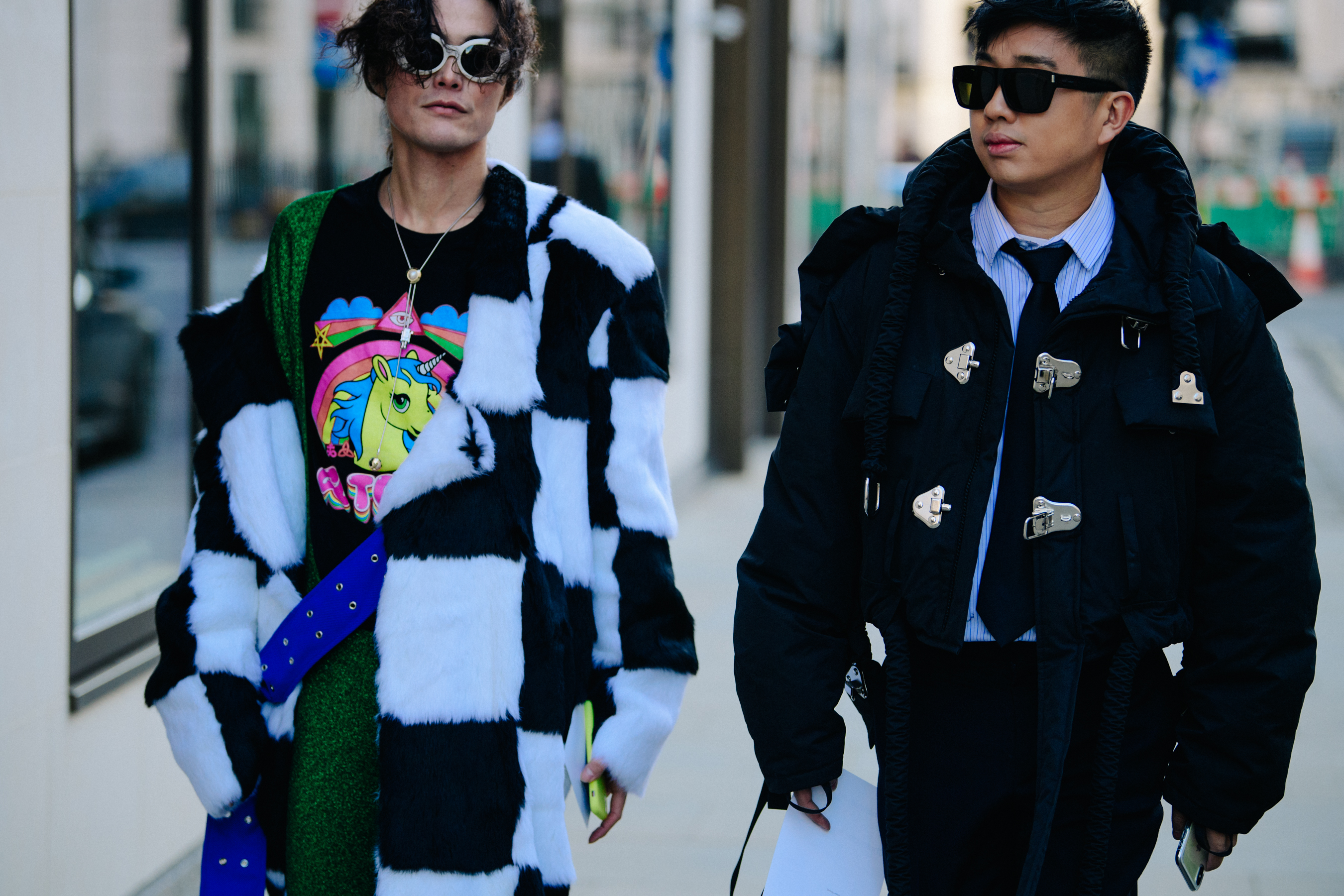 Two Asian men wearing black and white