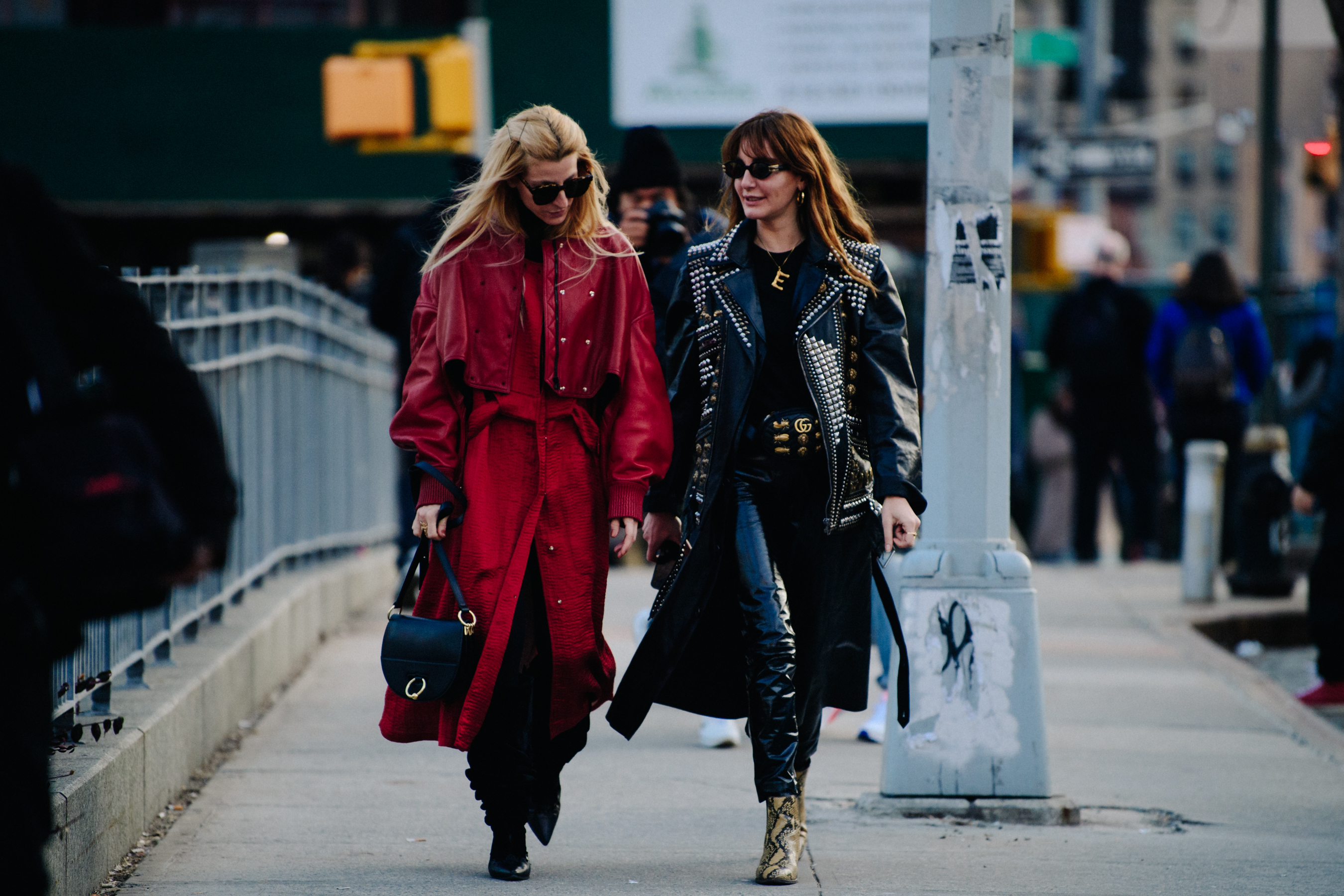 Two women wearing studded leather jackets