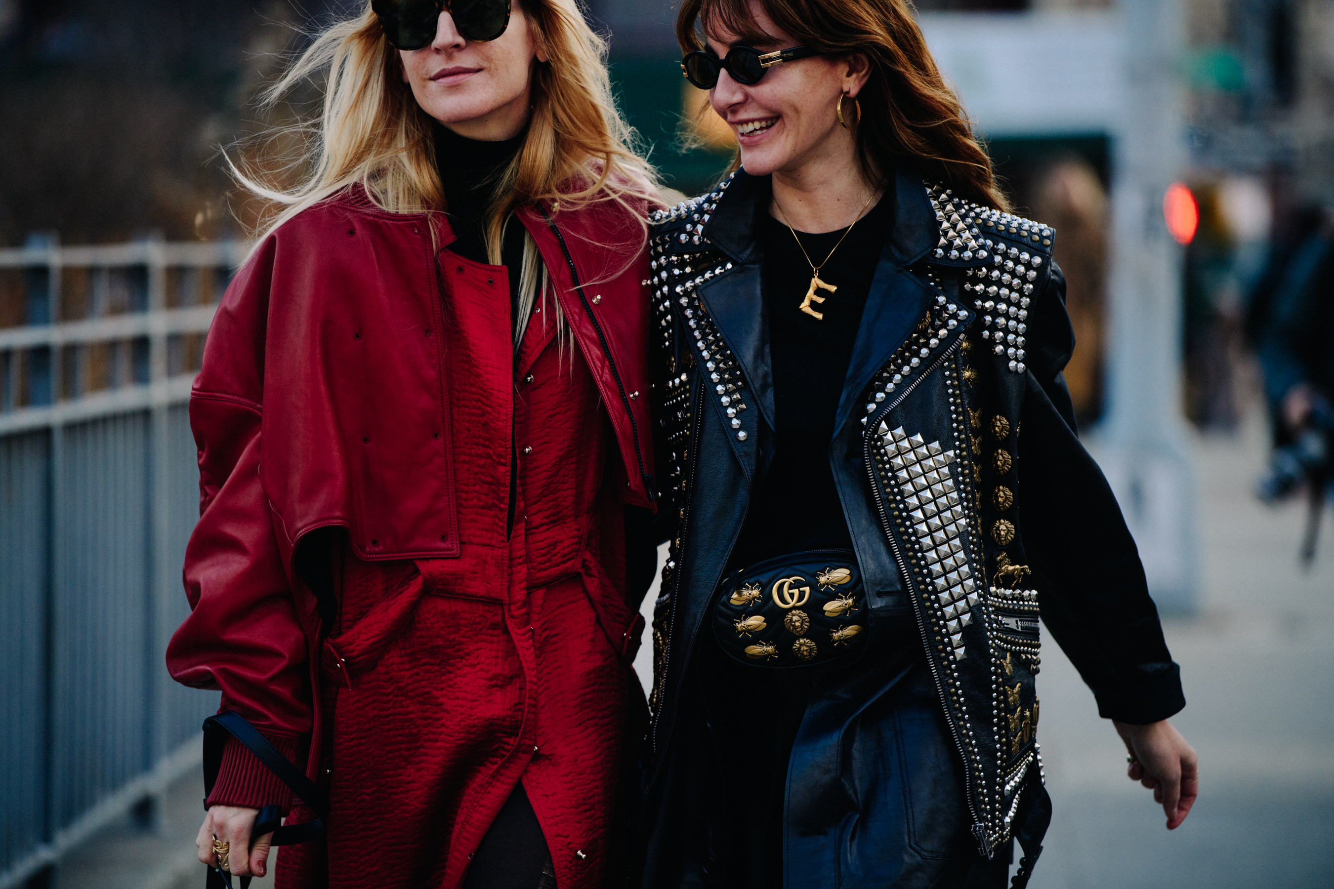 Two women wearing studded leather jackets