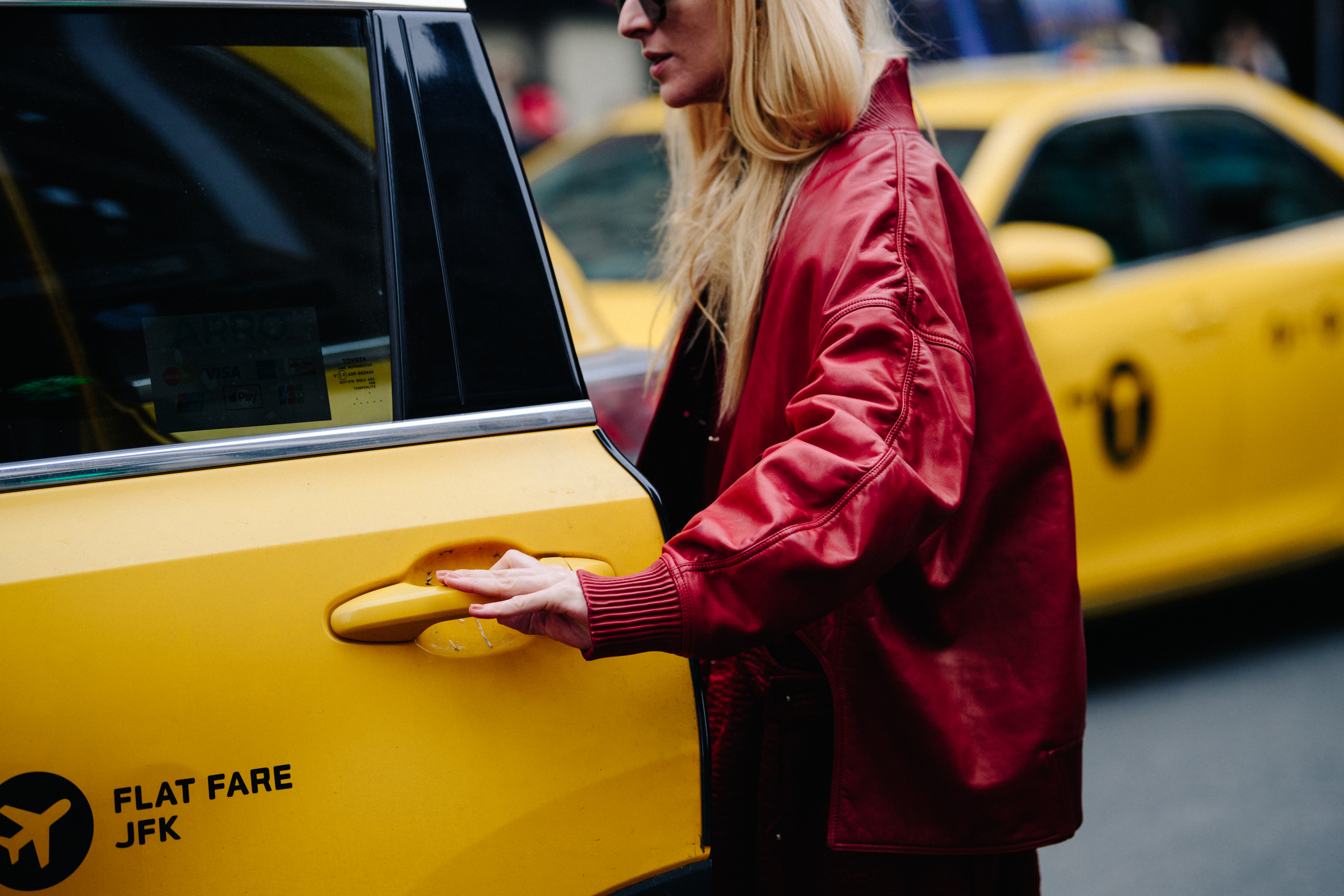 Woman wearing red leather jacket