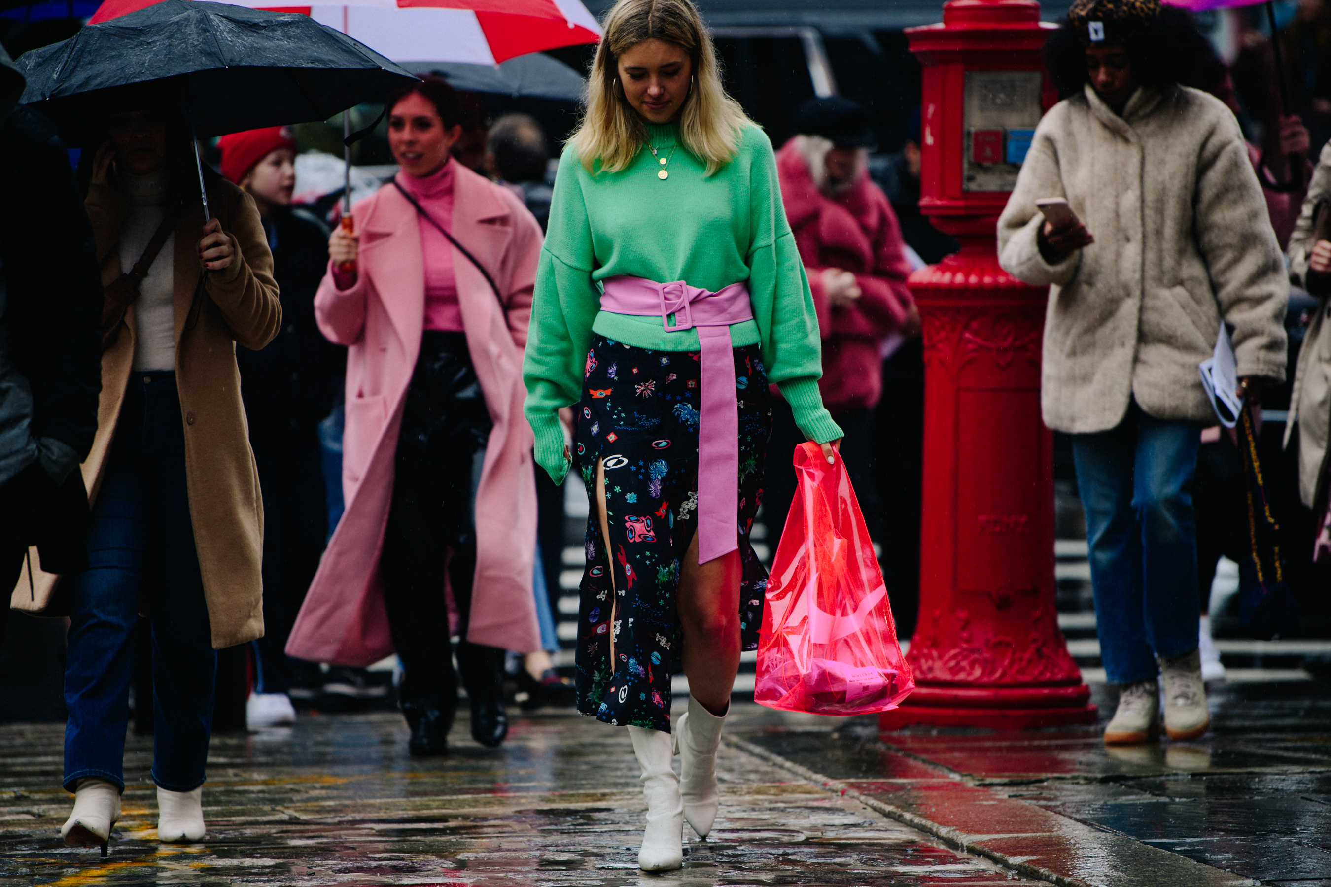 Woman wearing colourful pink belted outfit