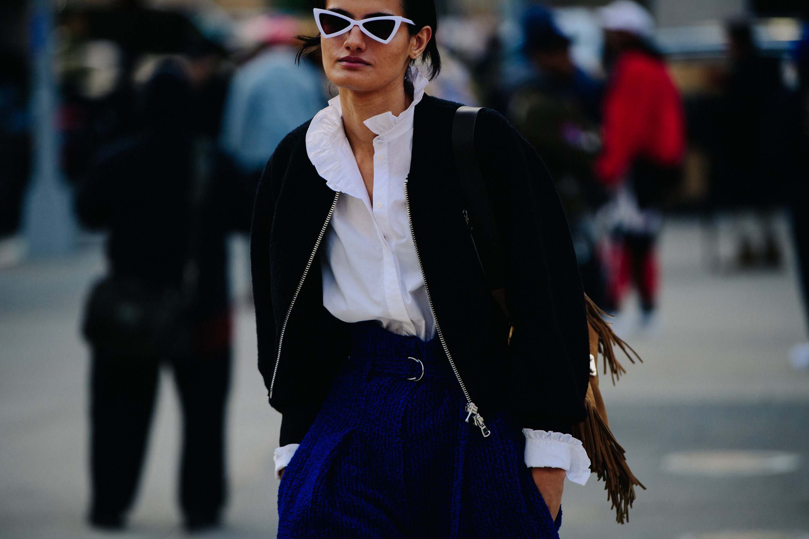Woman wearing white sunglasses