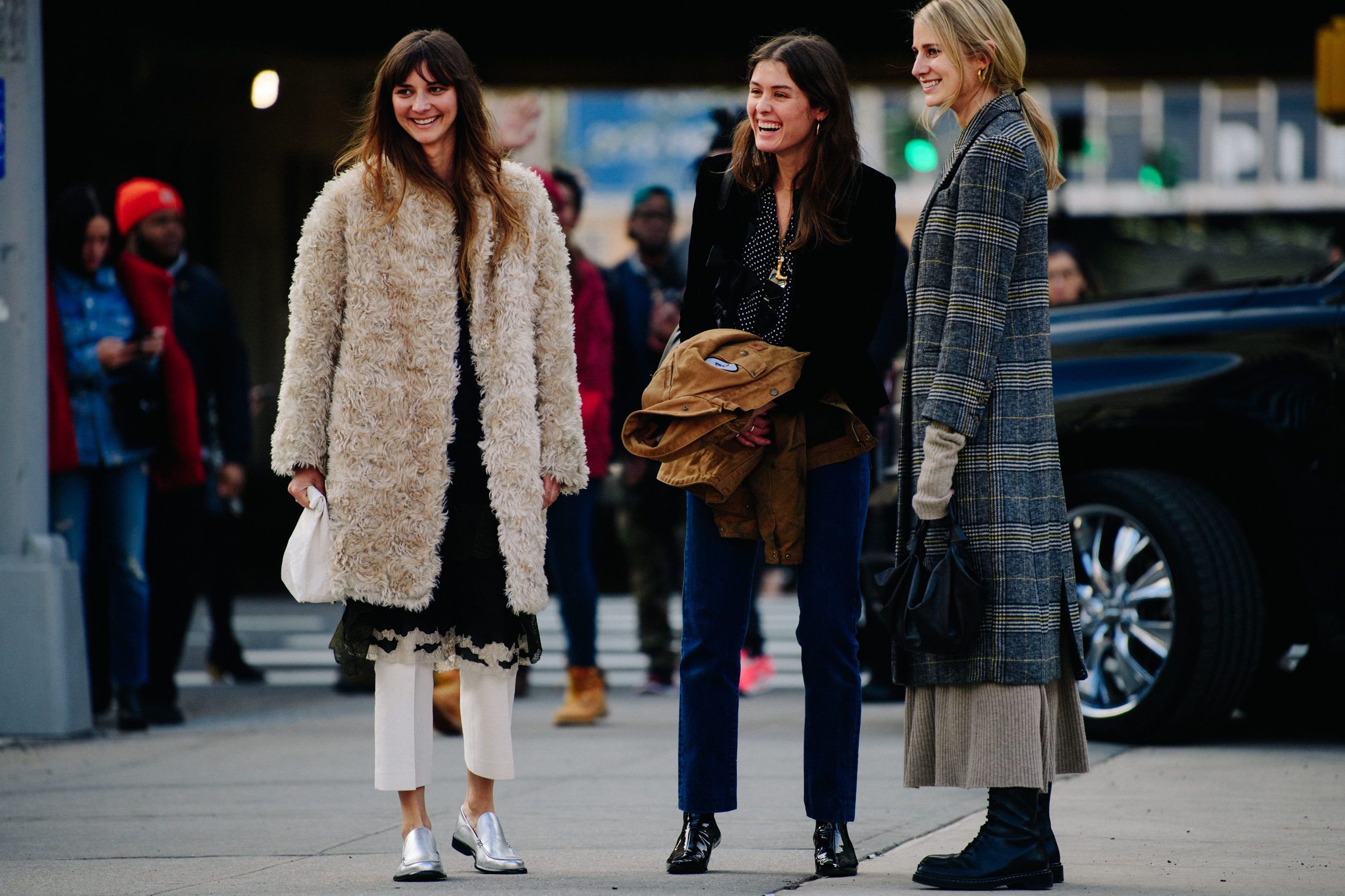 Three women wearing winter coats