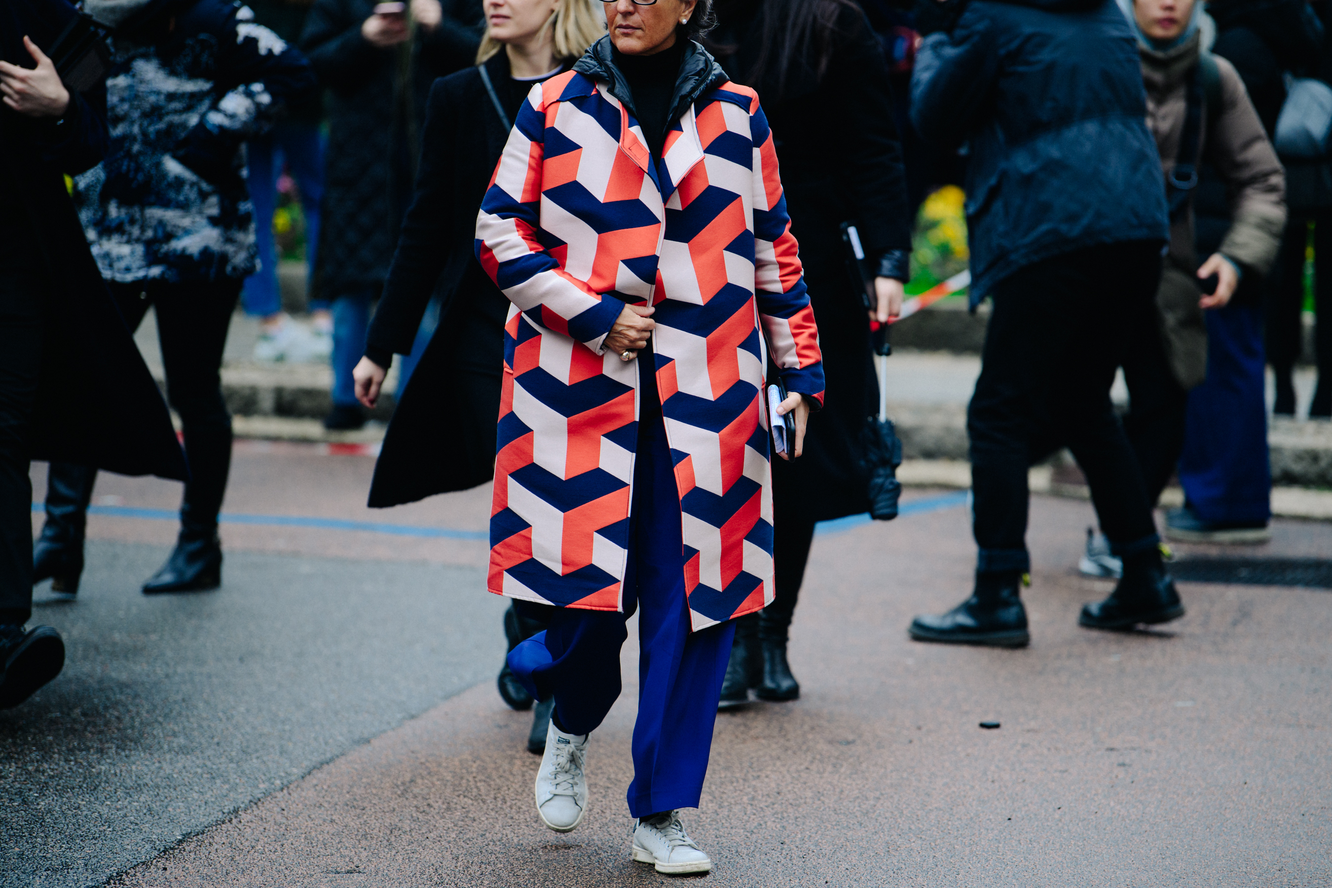 Woman wearing long colourful pattern coat