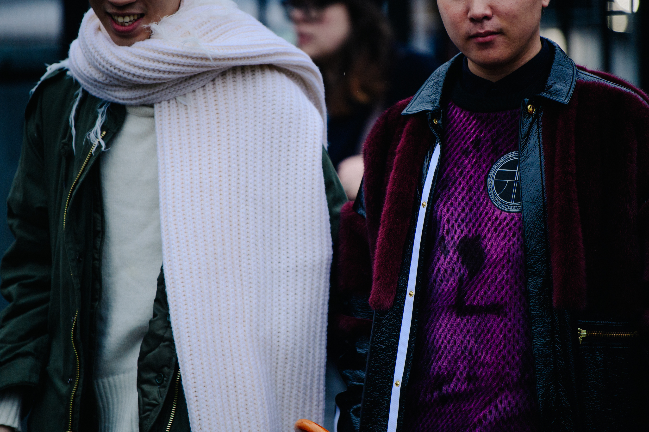 Two Asian men wearing light jackets