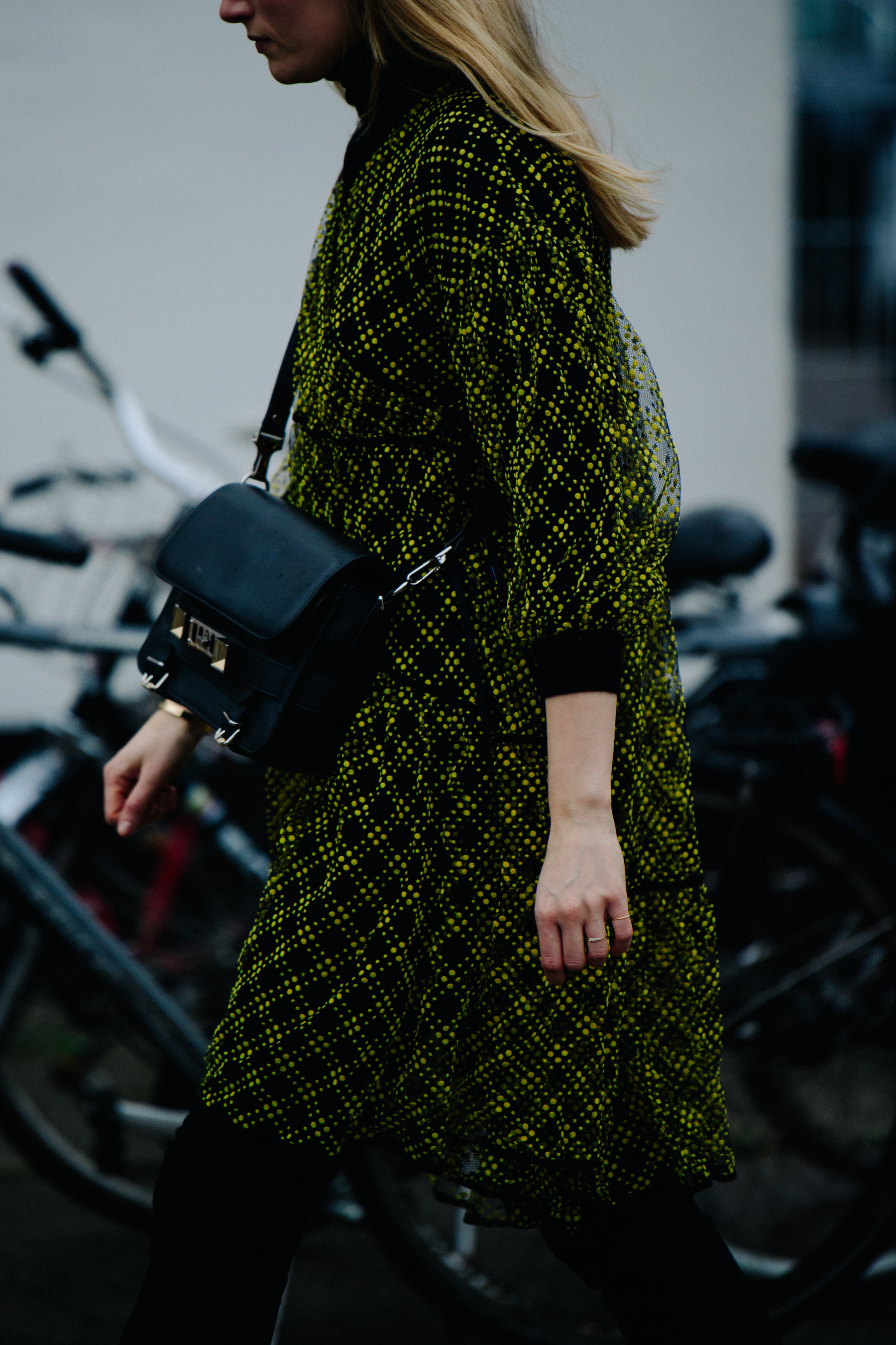 Woman wearing yellow and black dress