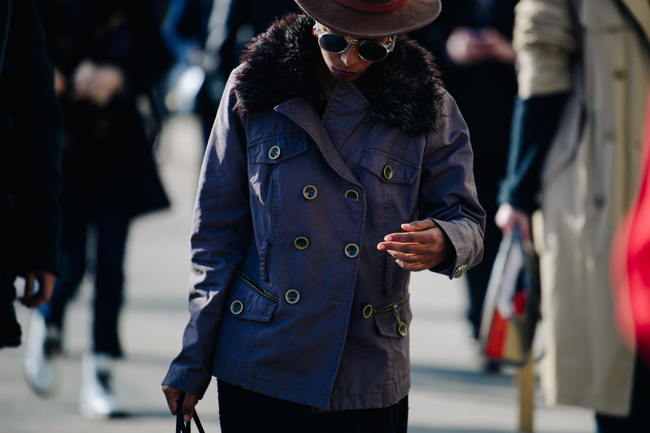 Woman wearing purple button jacket