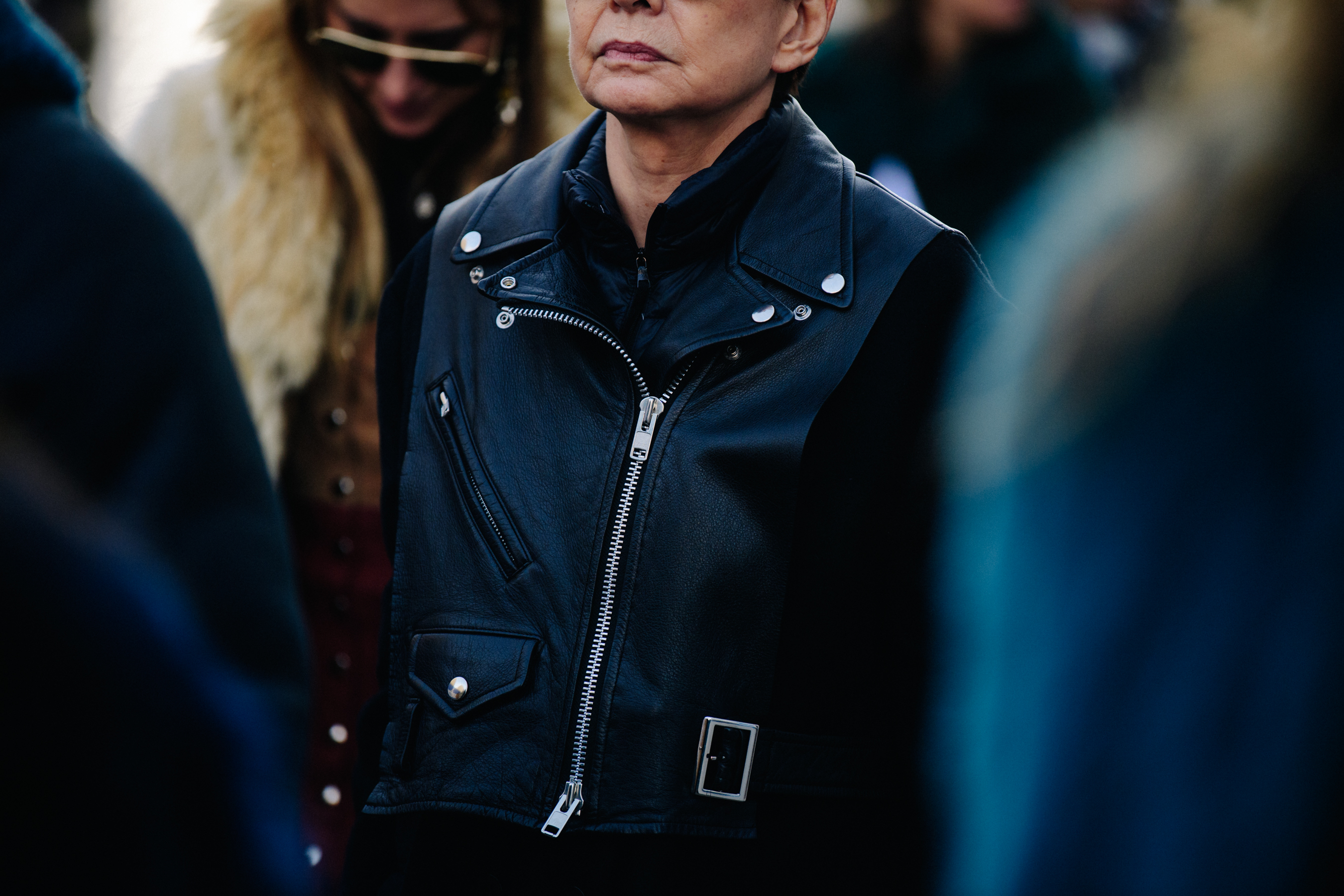 Woman wearing black leather biker jacket