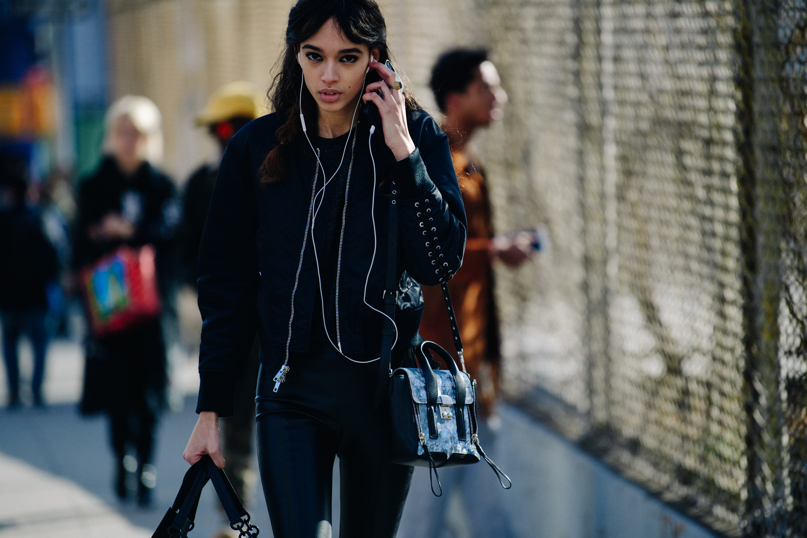 Model wearing black bomber jacket