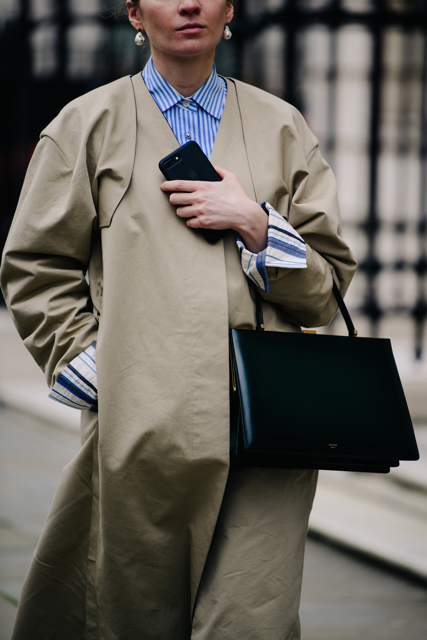 Woman wearing tan overcoat