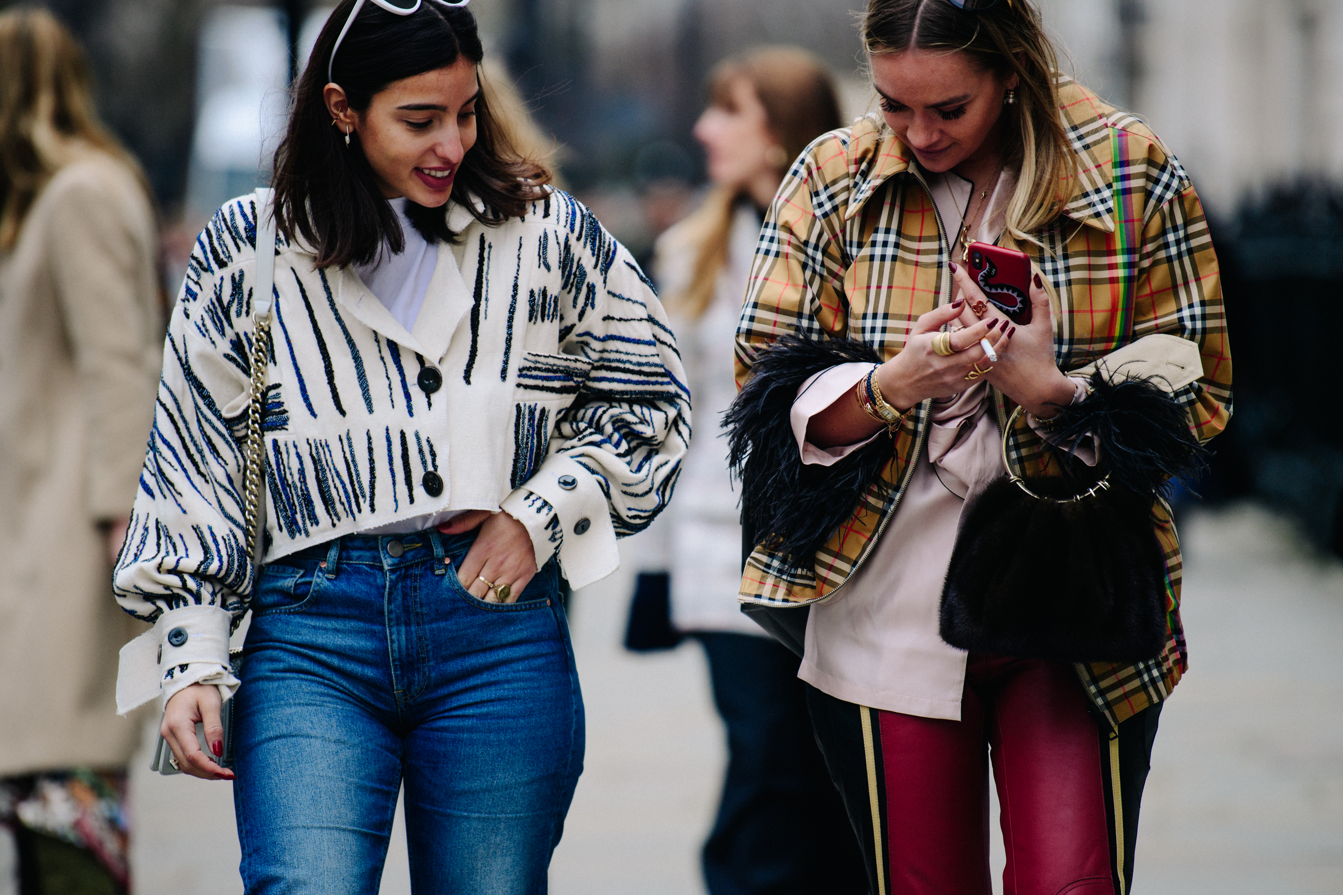 Two women wearing pattern jackets