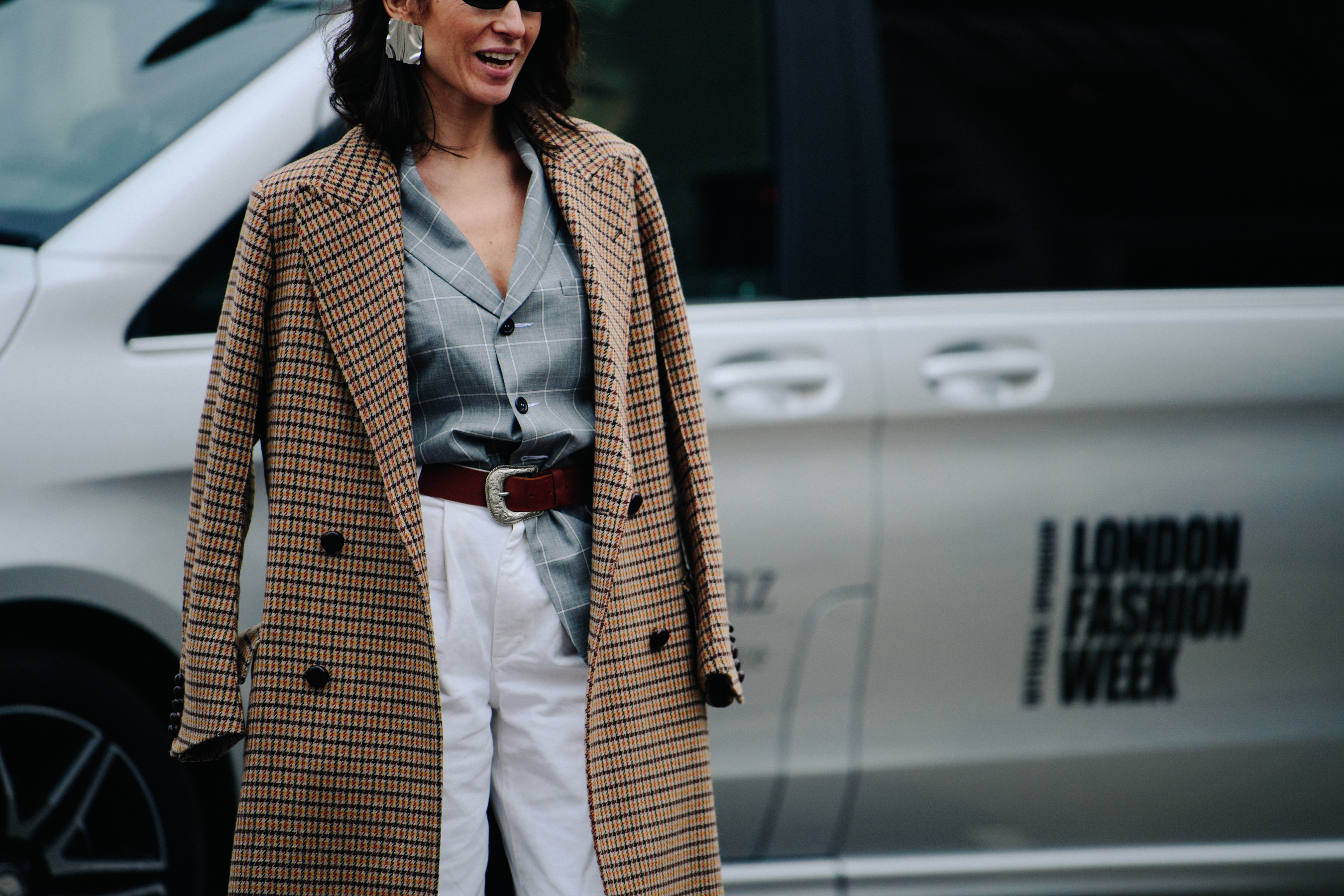 Woman wearing grey check shirt