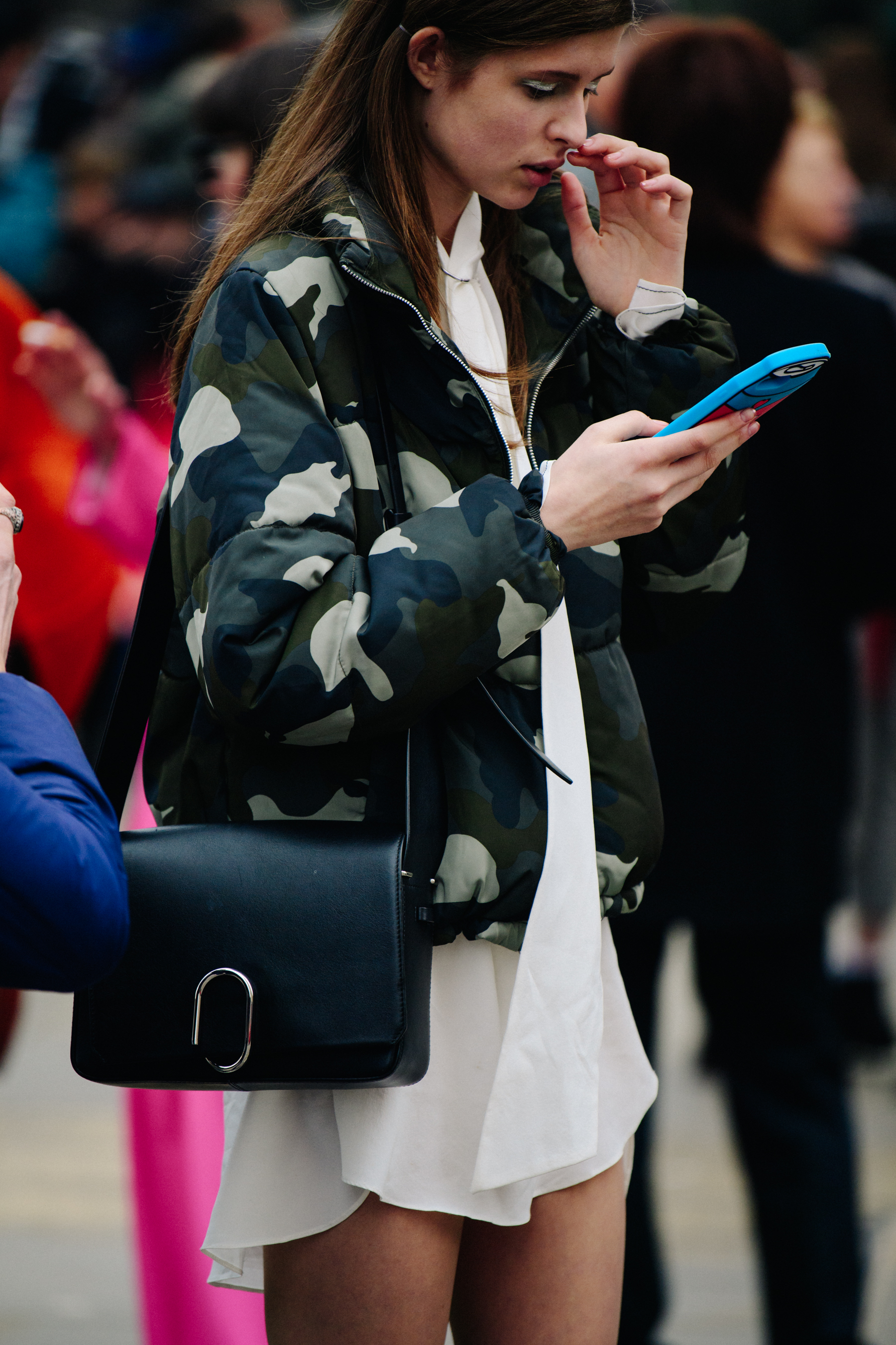 Model wearing camouflage jacket