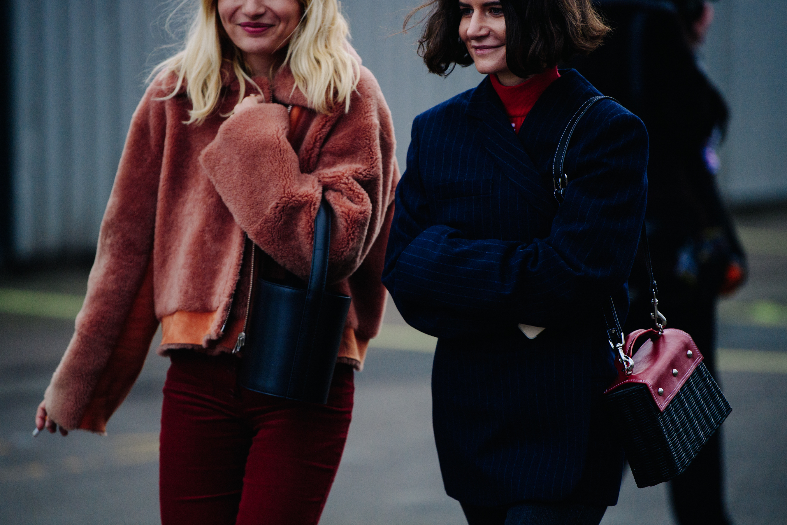 Two women wearing short jackets