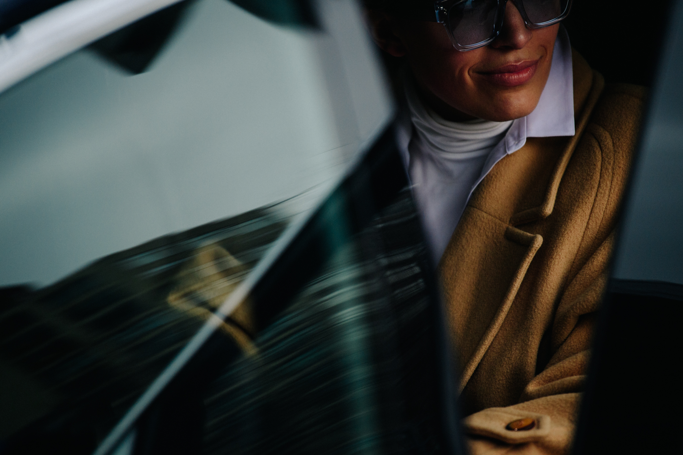Woman wearing sunglasses in car