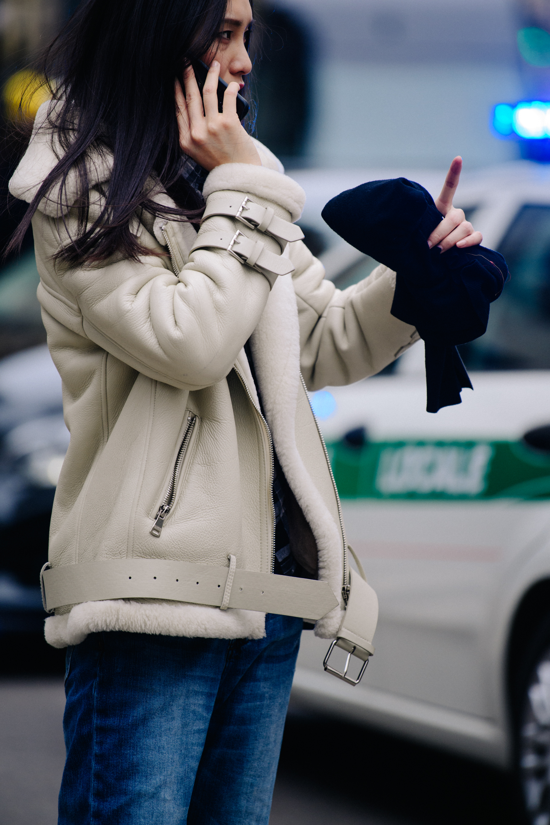 Asian model wearing white leather jacket