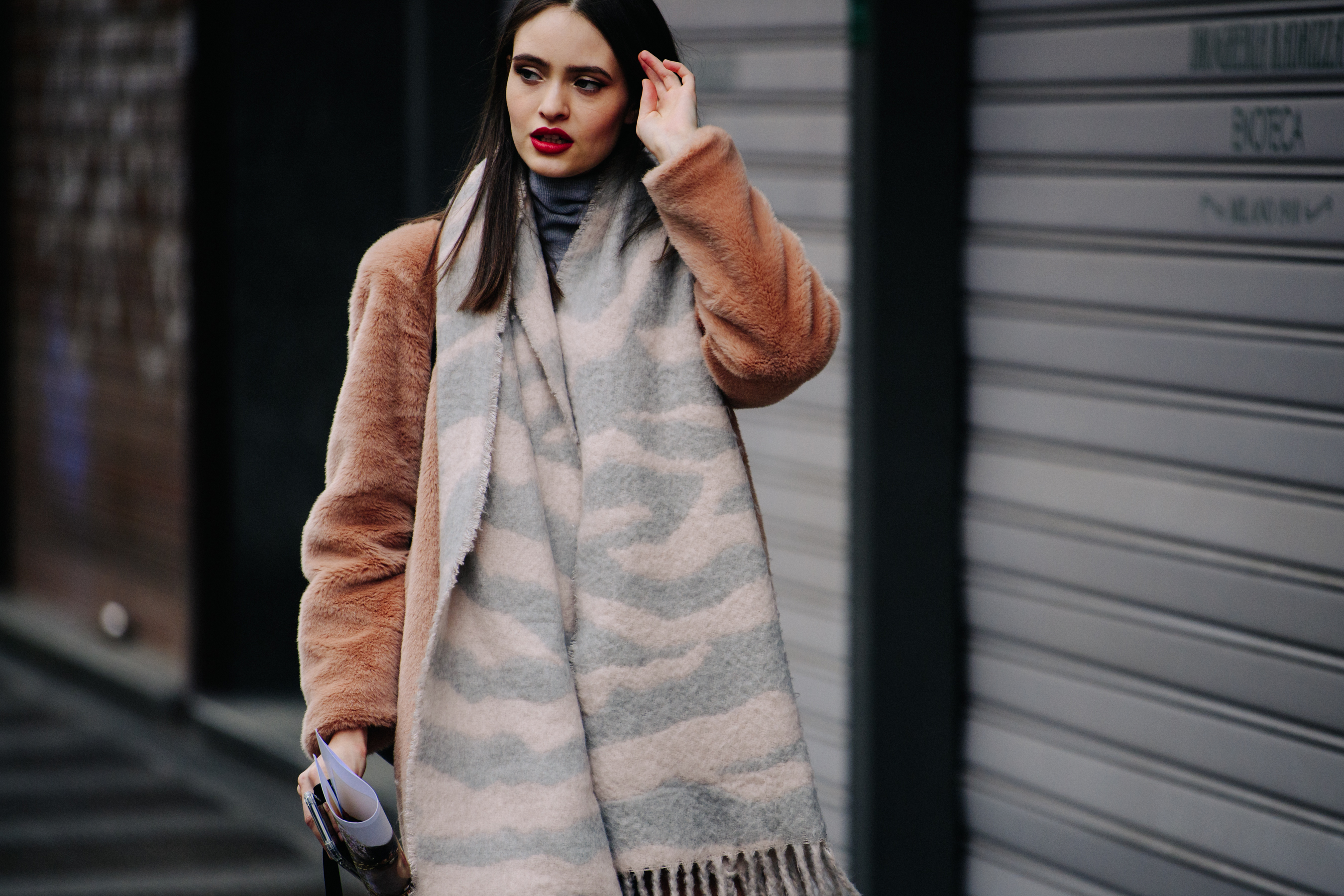 Model wearing light brown jacket
