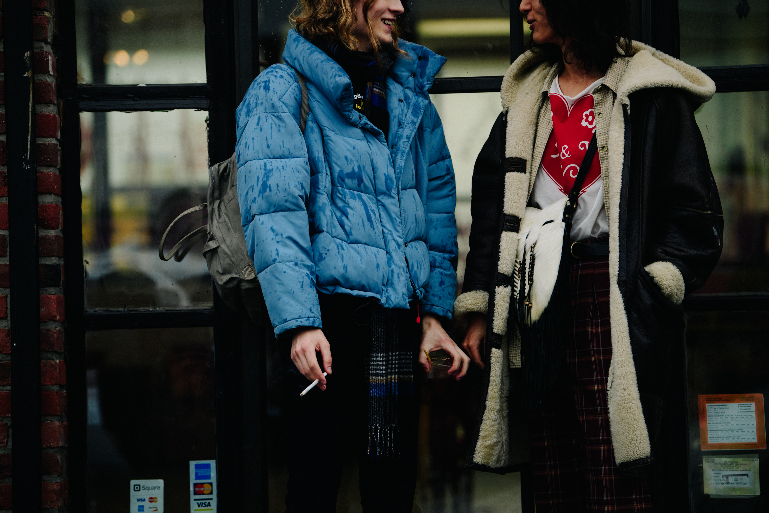 Two models wearing winter coats