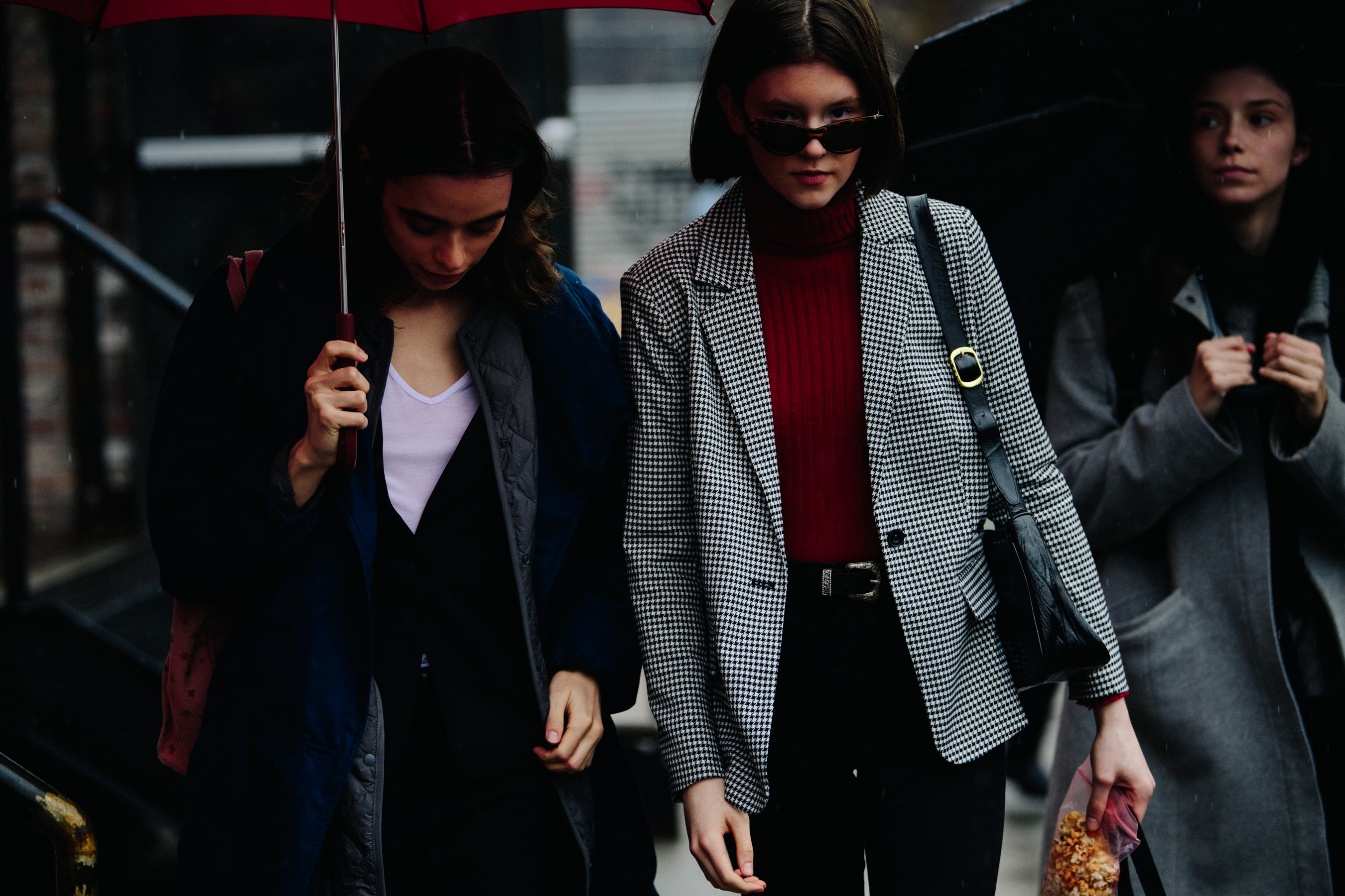 Two women wearing smart jackets