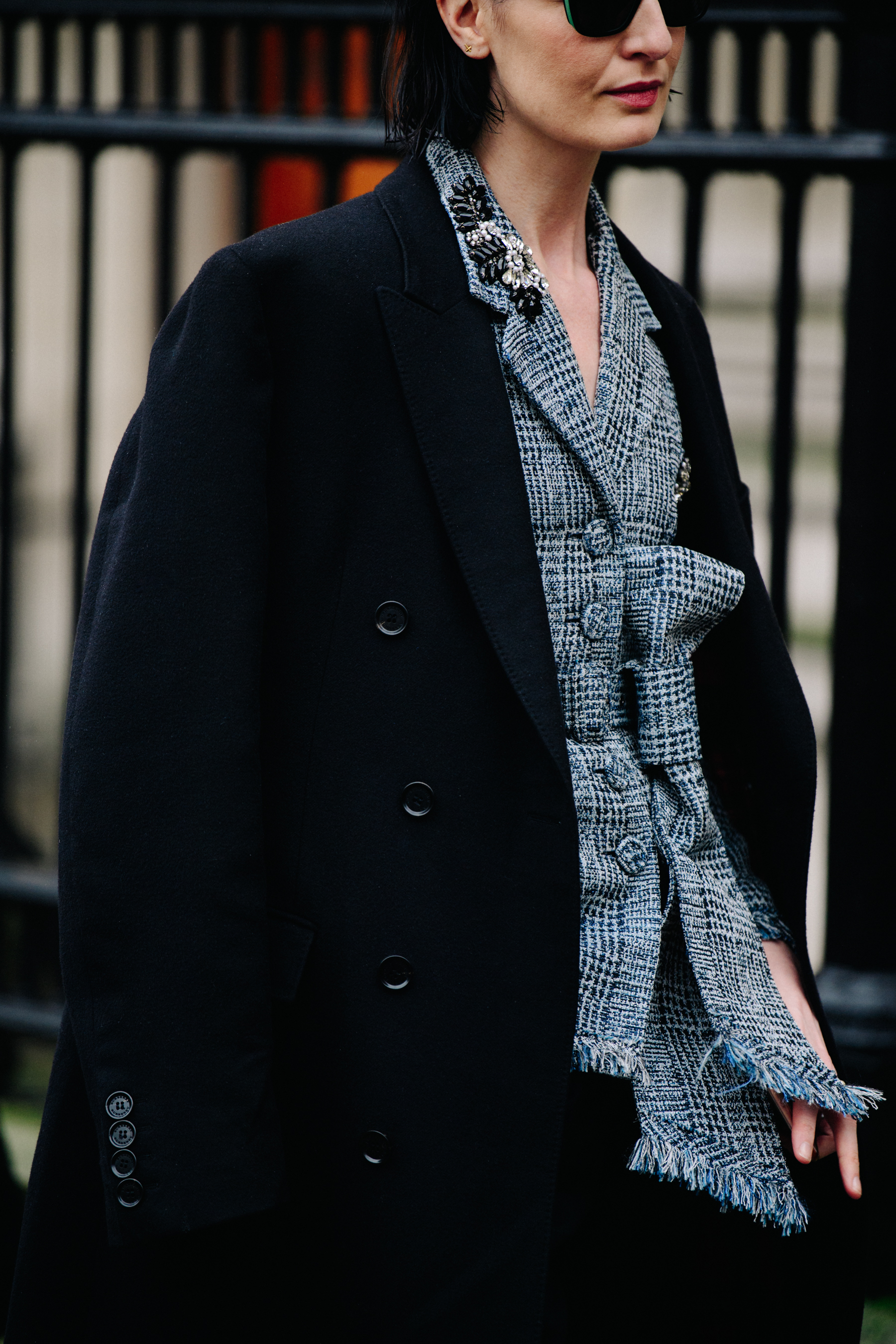 Woman wearing long black coat