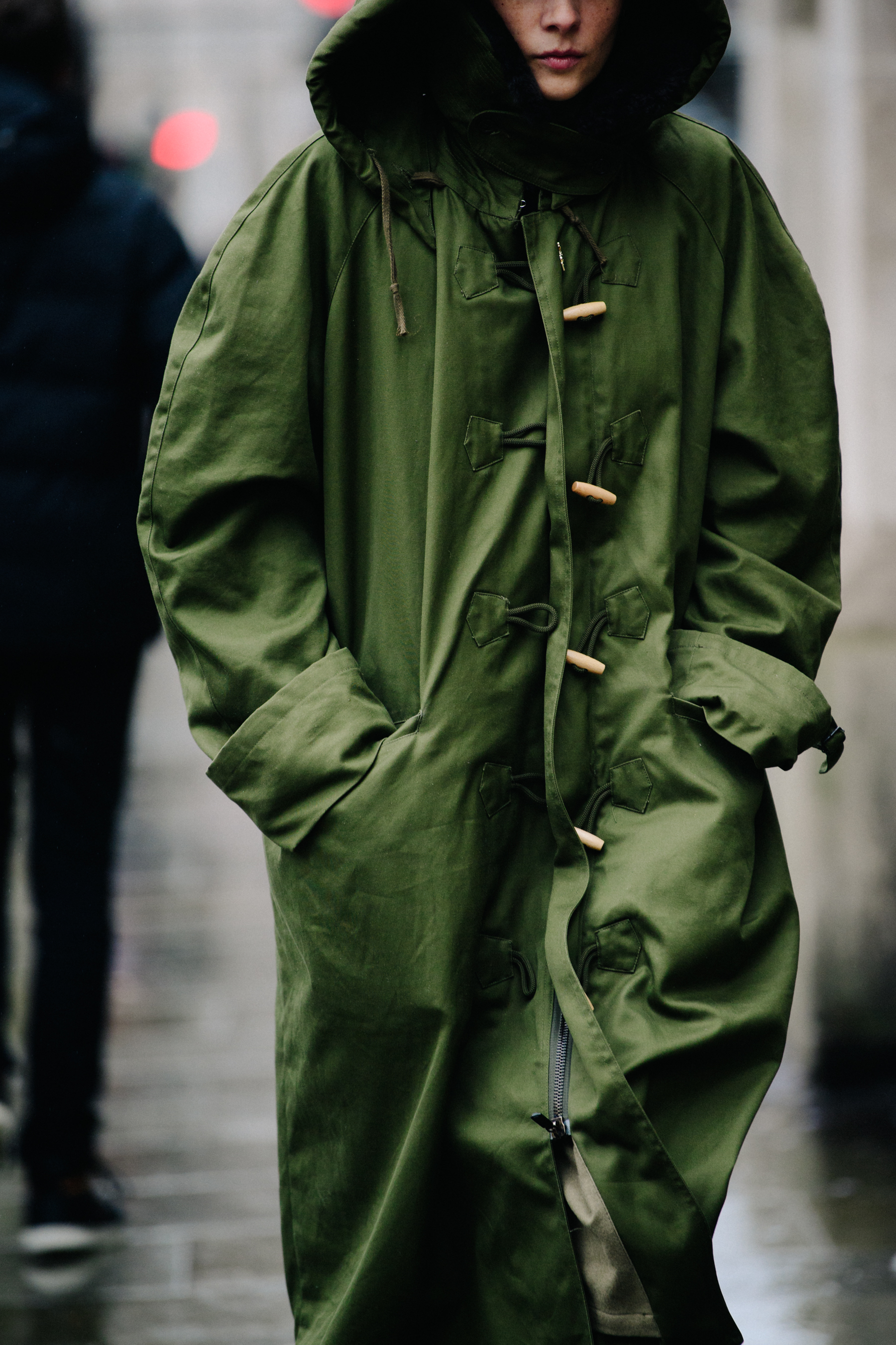Woman wearing thick green parka