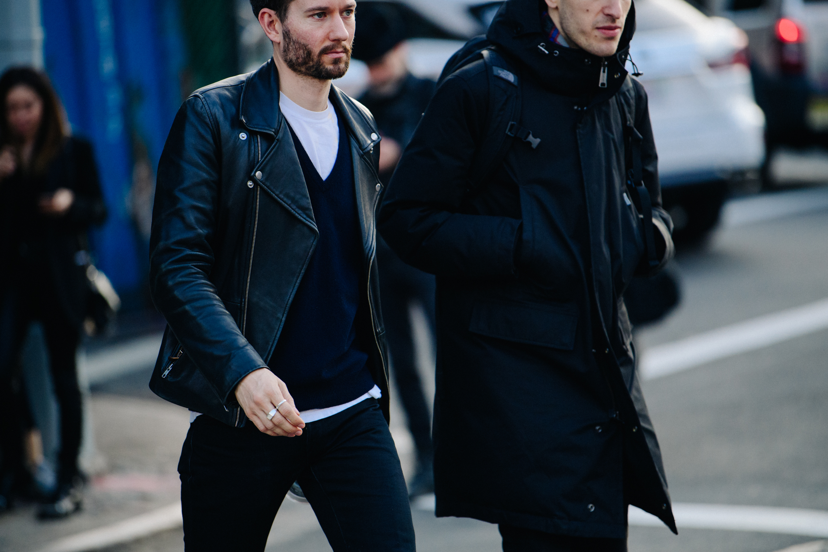 Two men wearing dark jackets