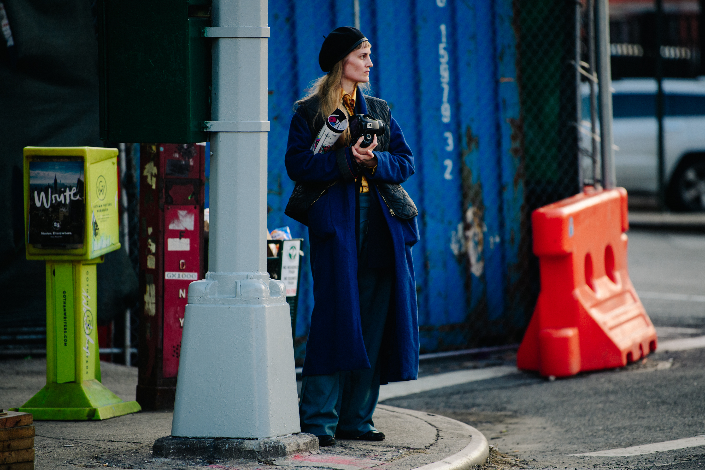 Woman wearing long blue coat