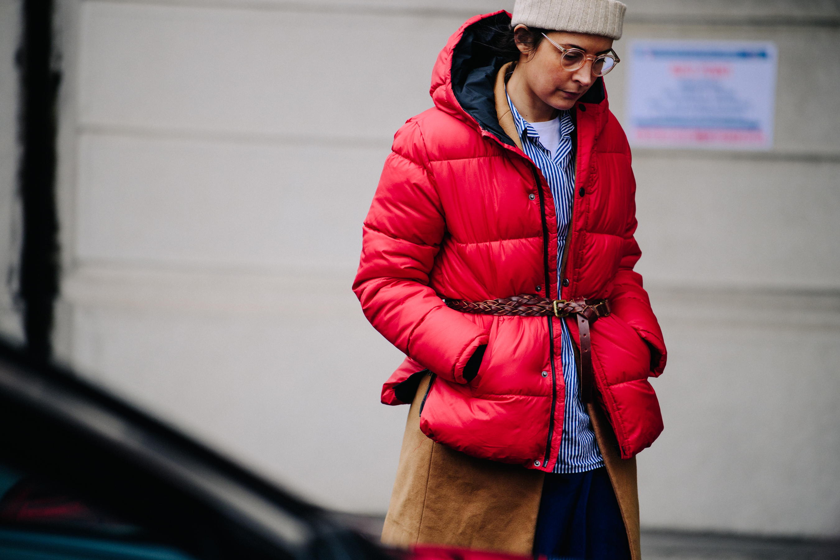 Woman wearing red belted coat