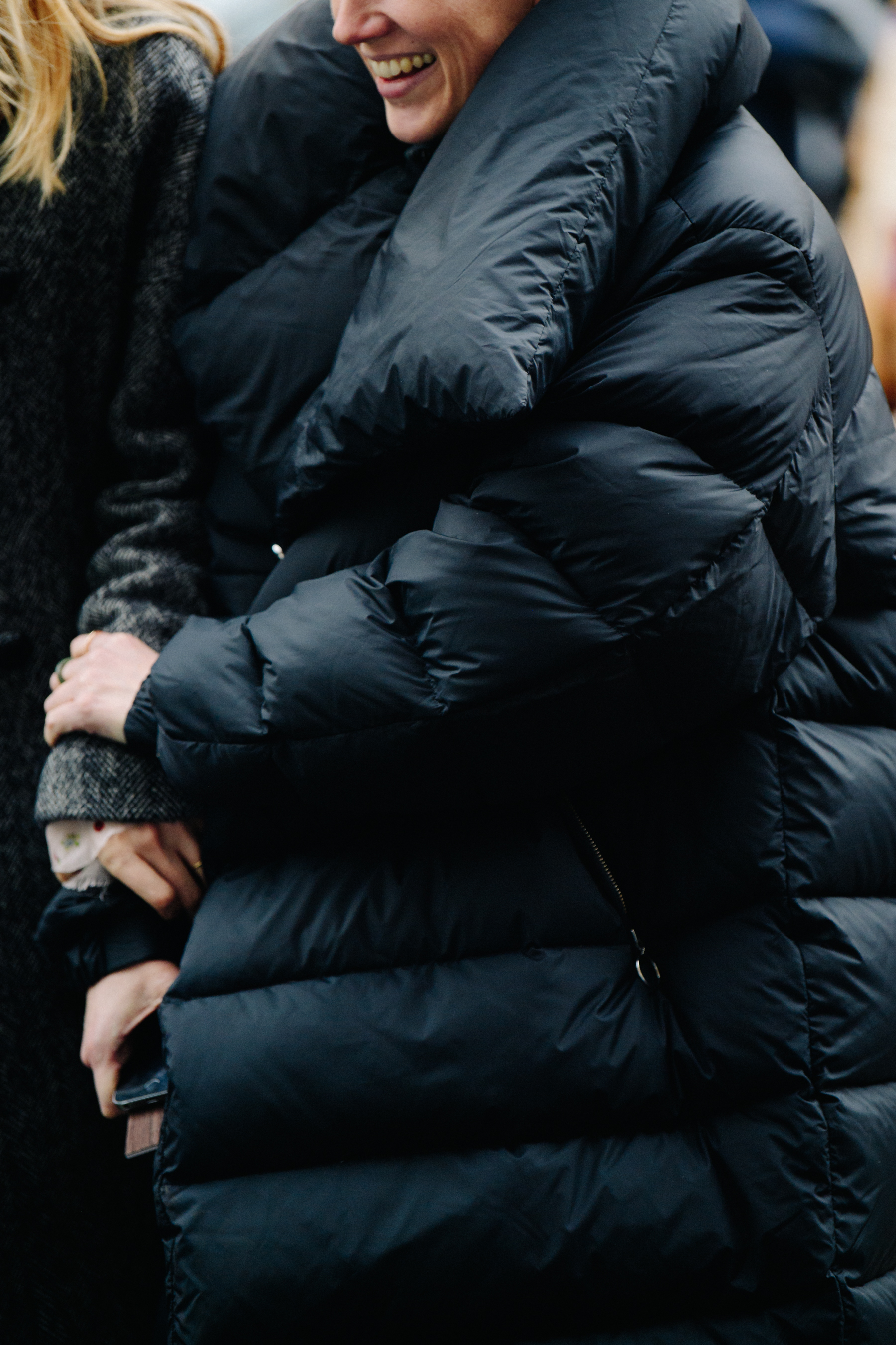 Woman wearing big black puffer coat