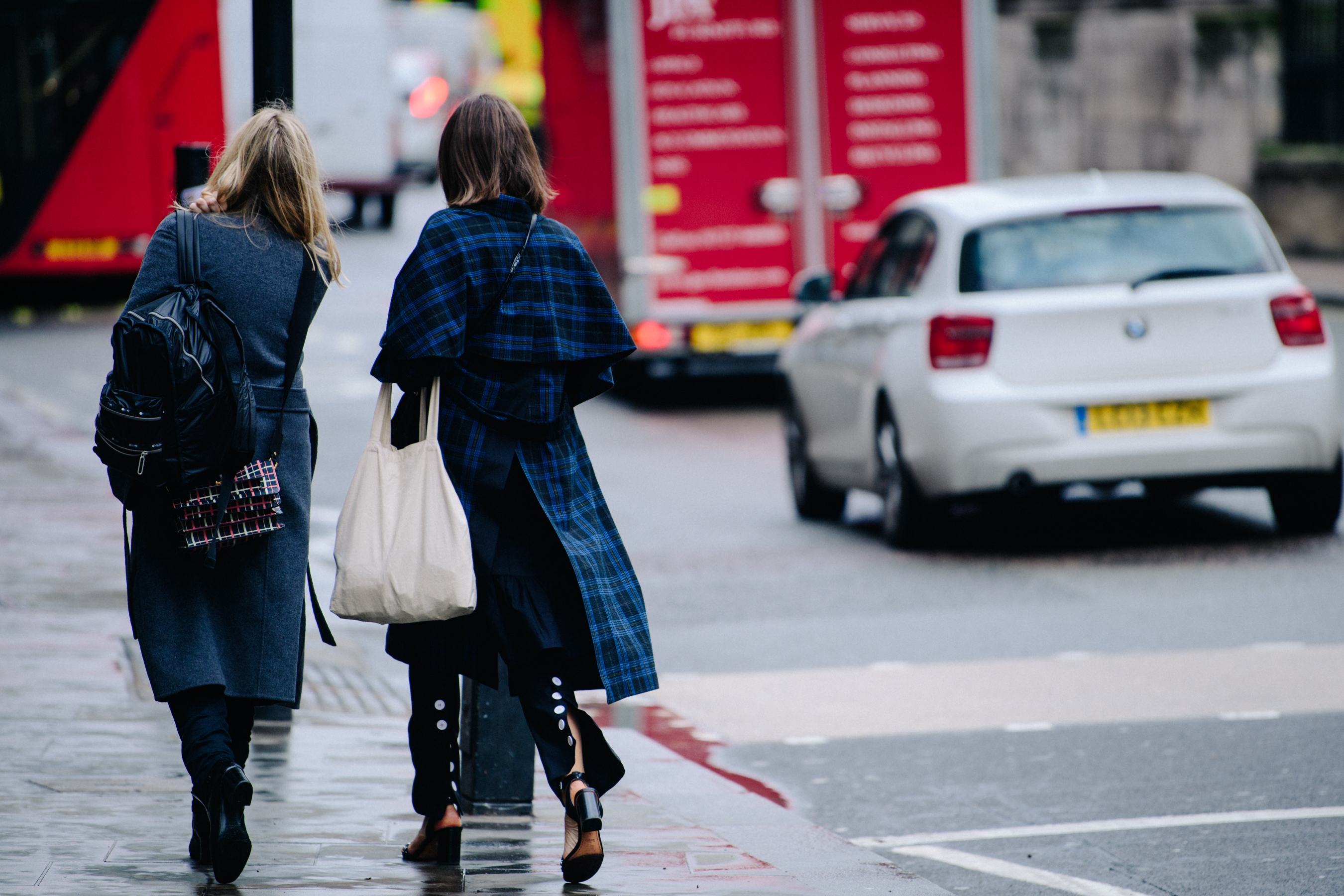 Two women wearing grey and blue