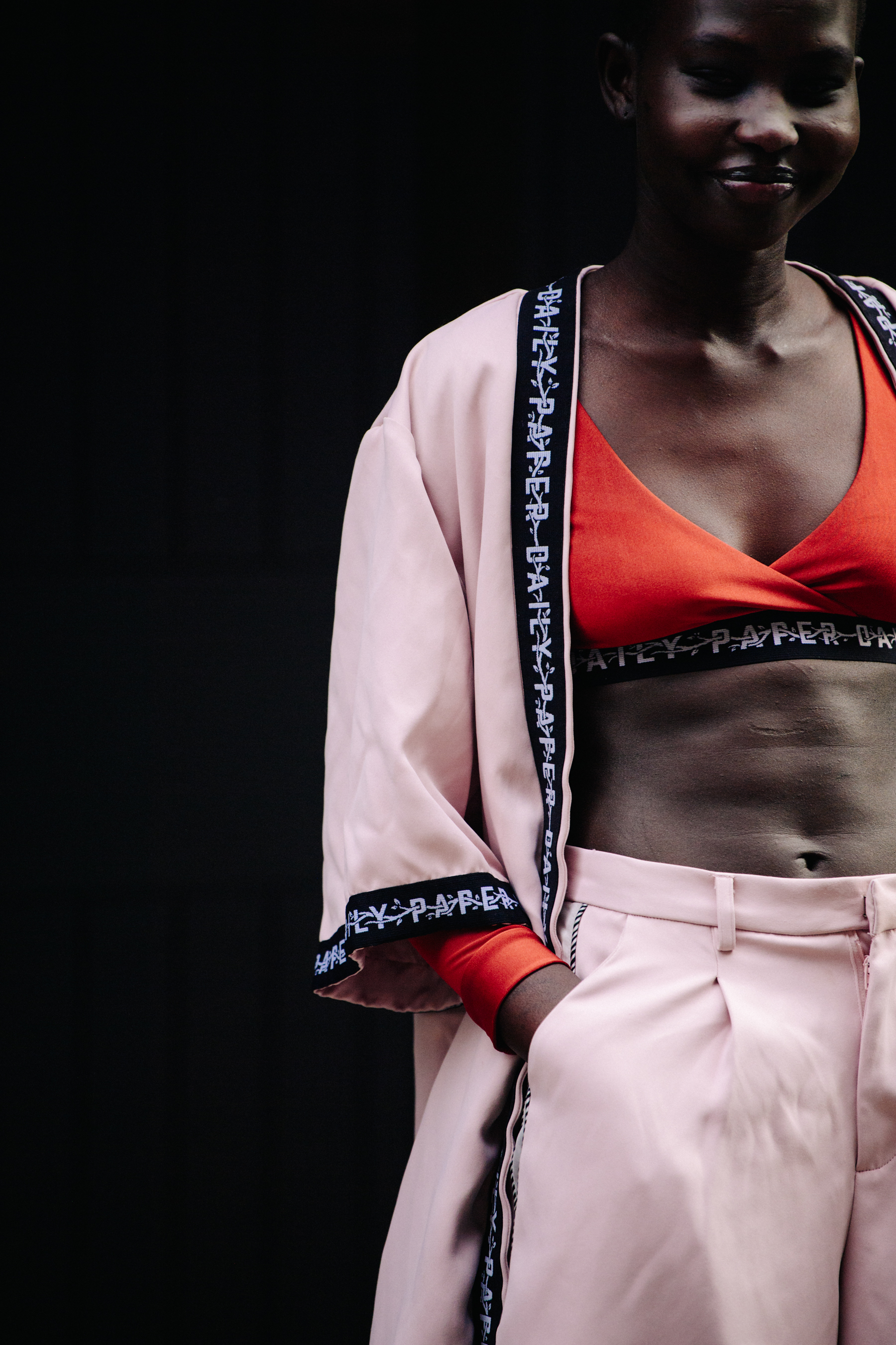 Model wearing pink outfit