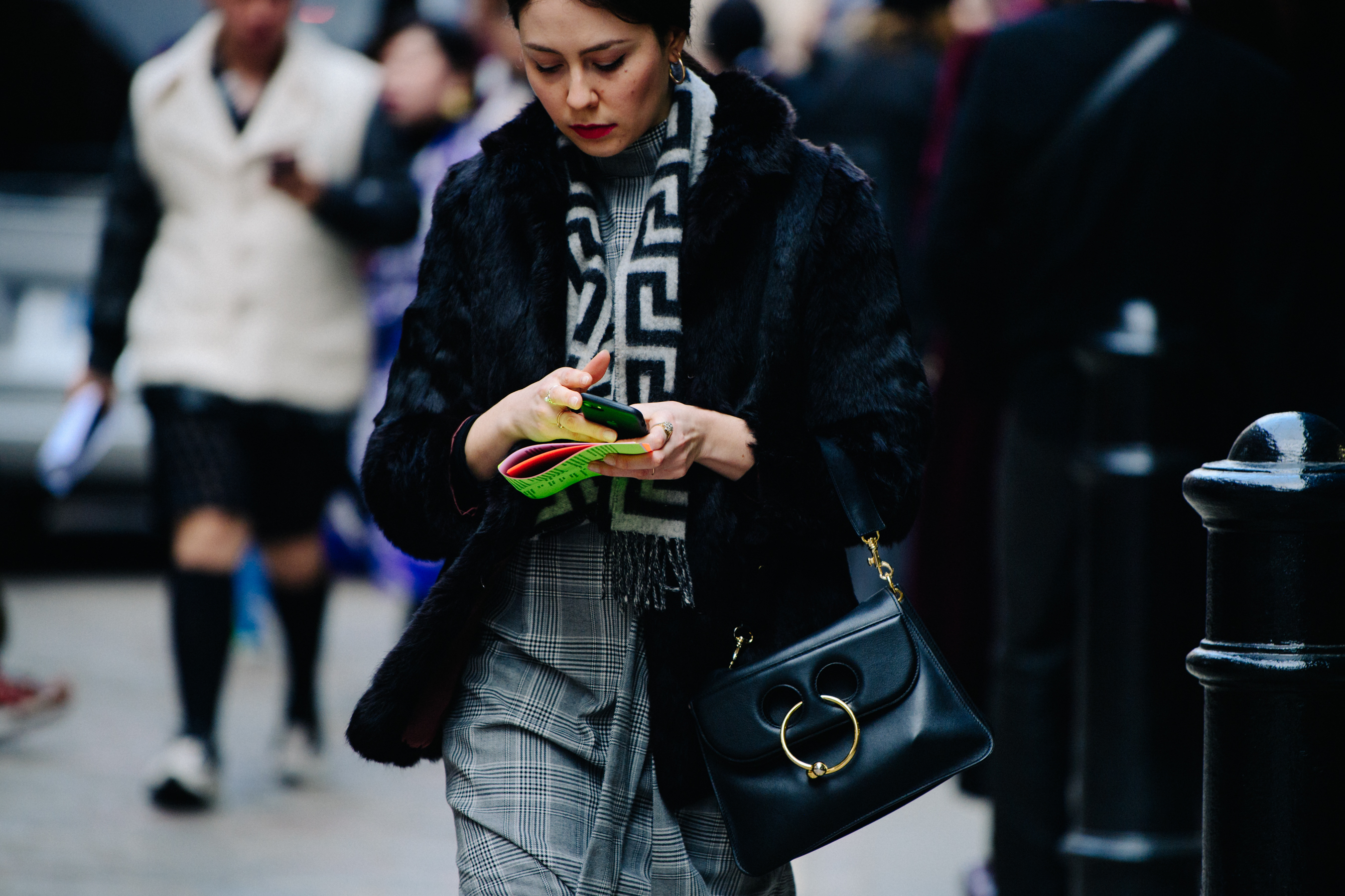 Woman carrying JW Anderson bag