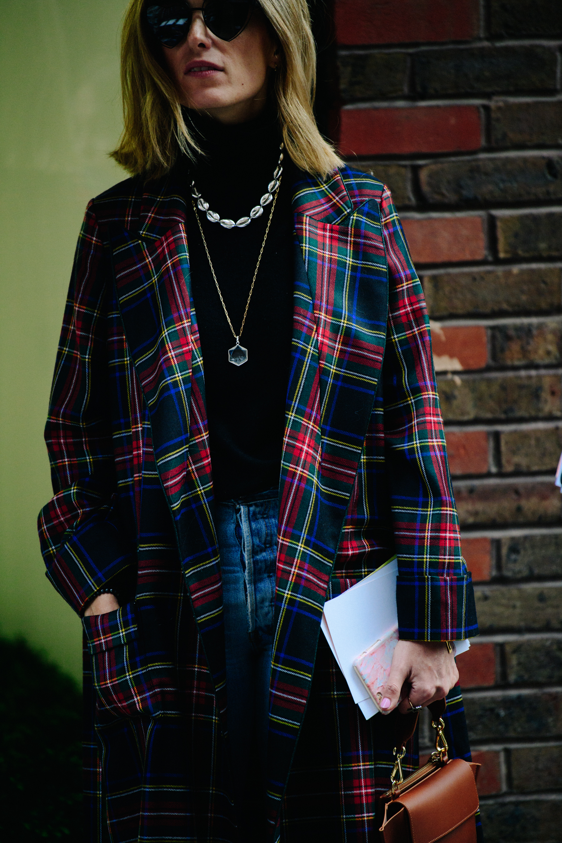 Woman wearing colourful check coat