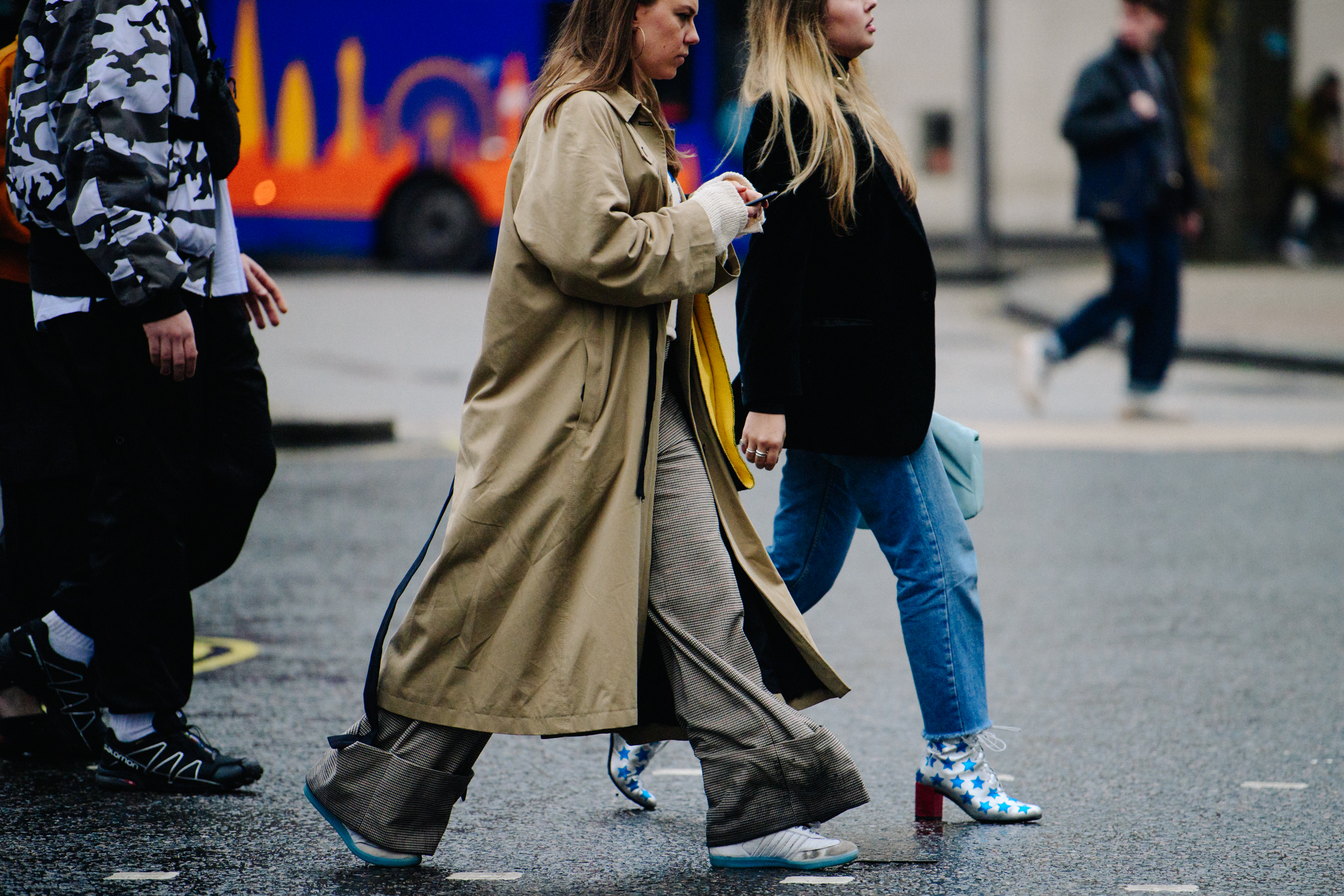 Two editors wearing blue and white shoes