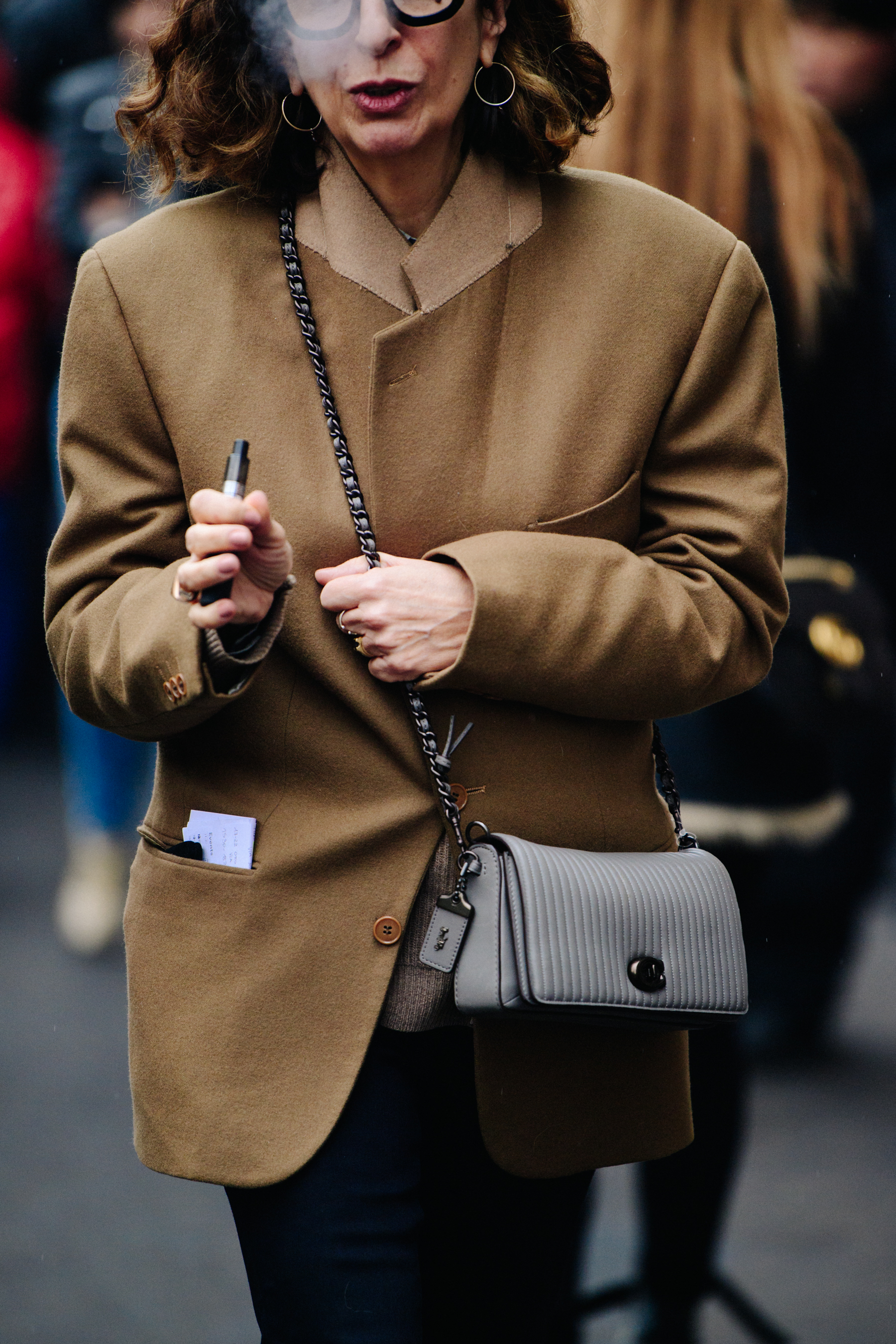 Woman wearing short brown wool coat