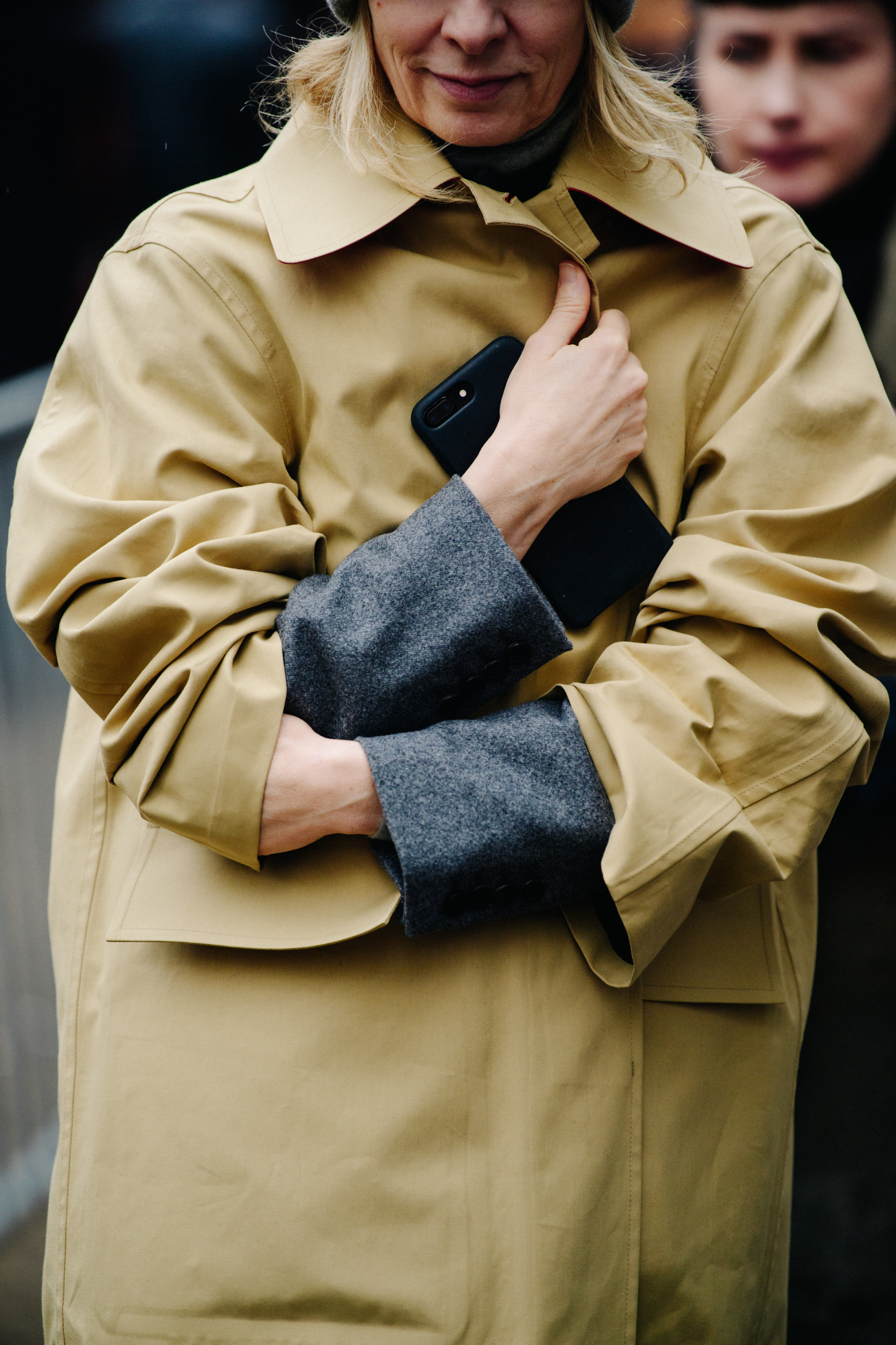 Woman wearing tan trench coat