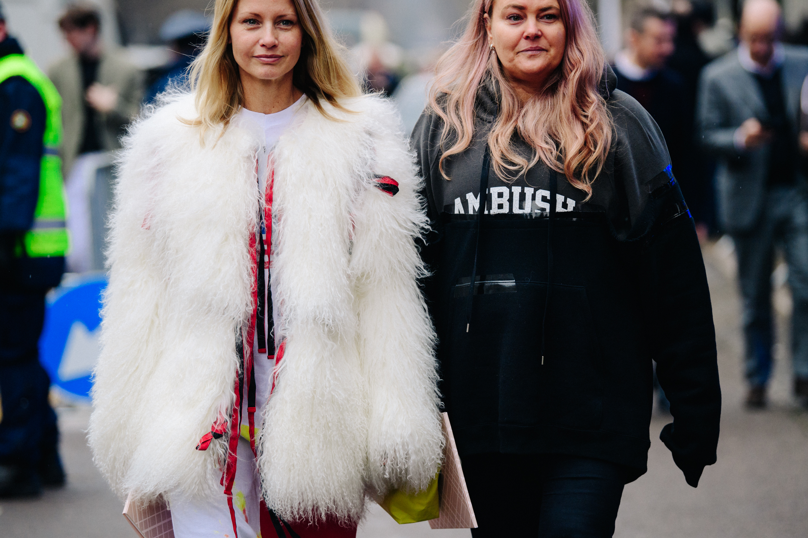 Two women wearing white and black outfits