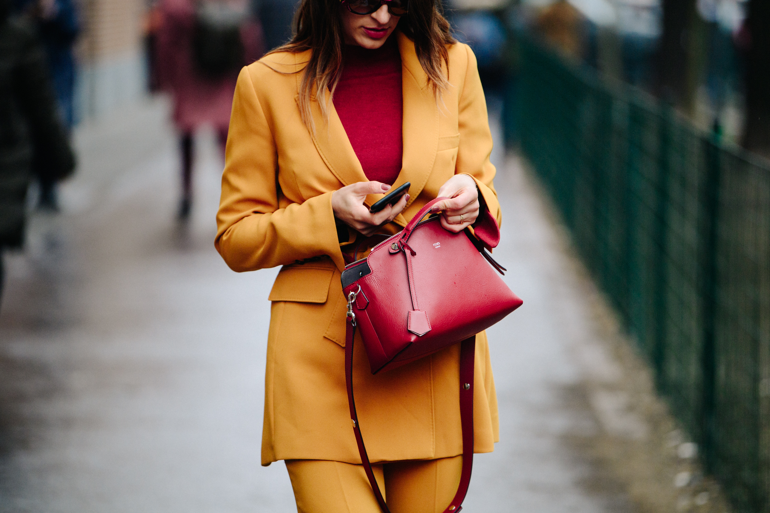 Woman wearing yellow and red suit