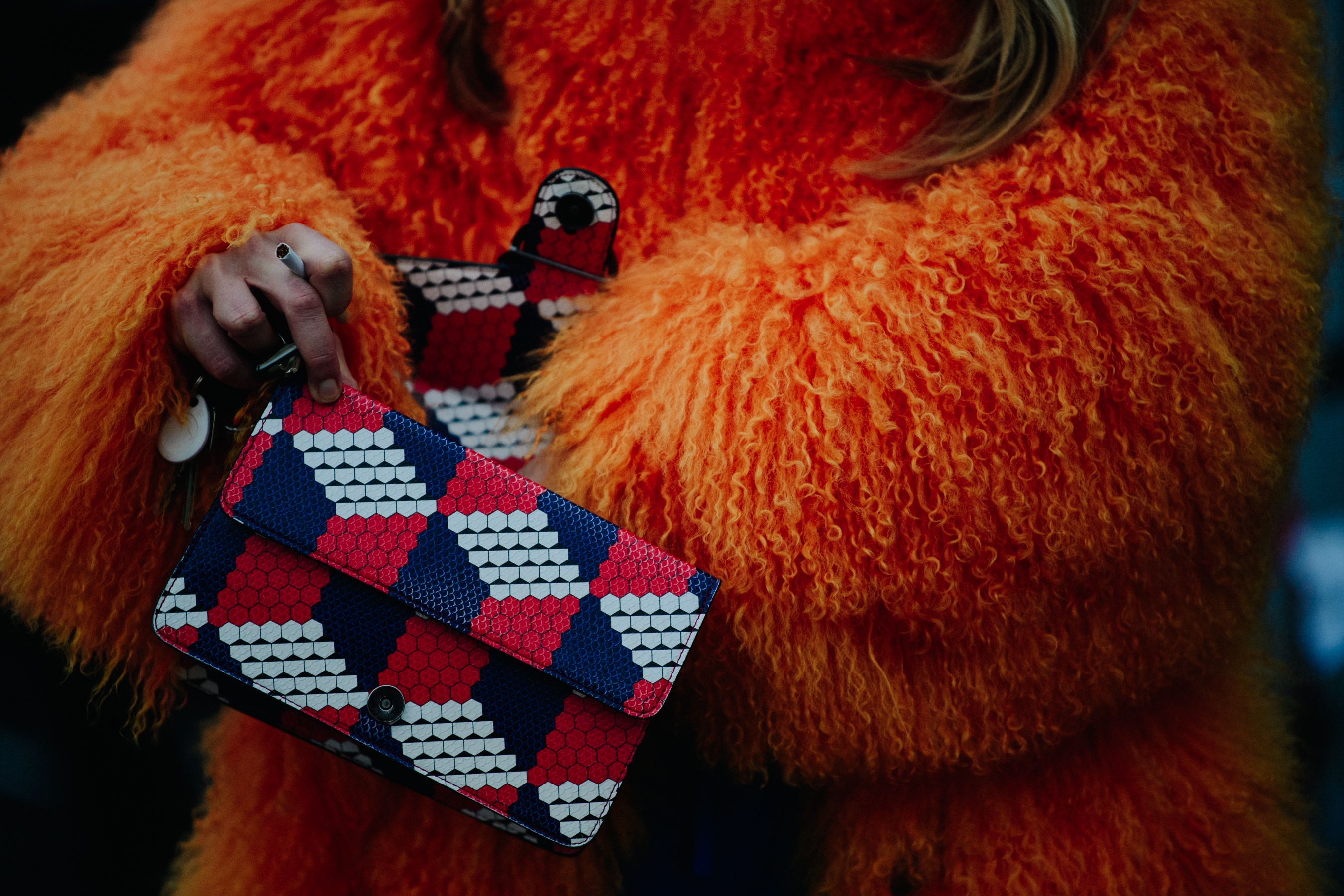 Woman wearing fuzzy orange jacket