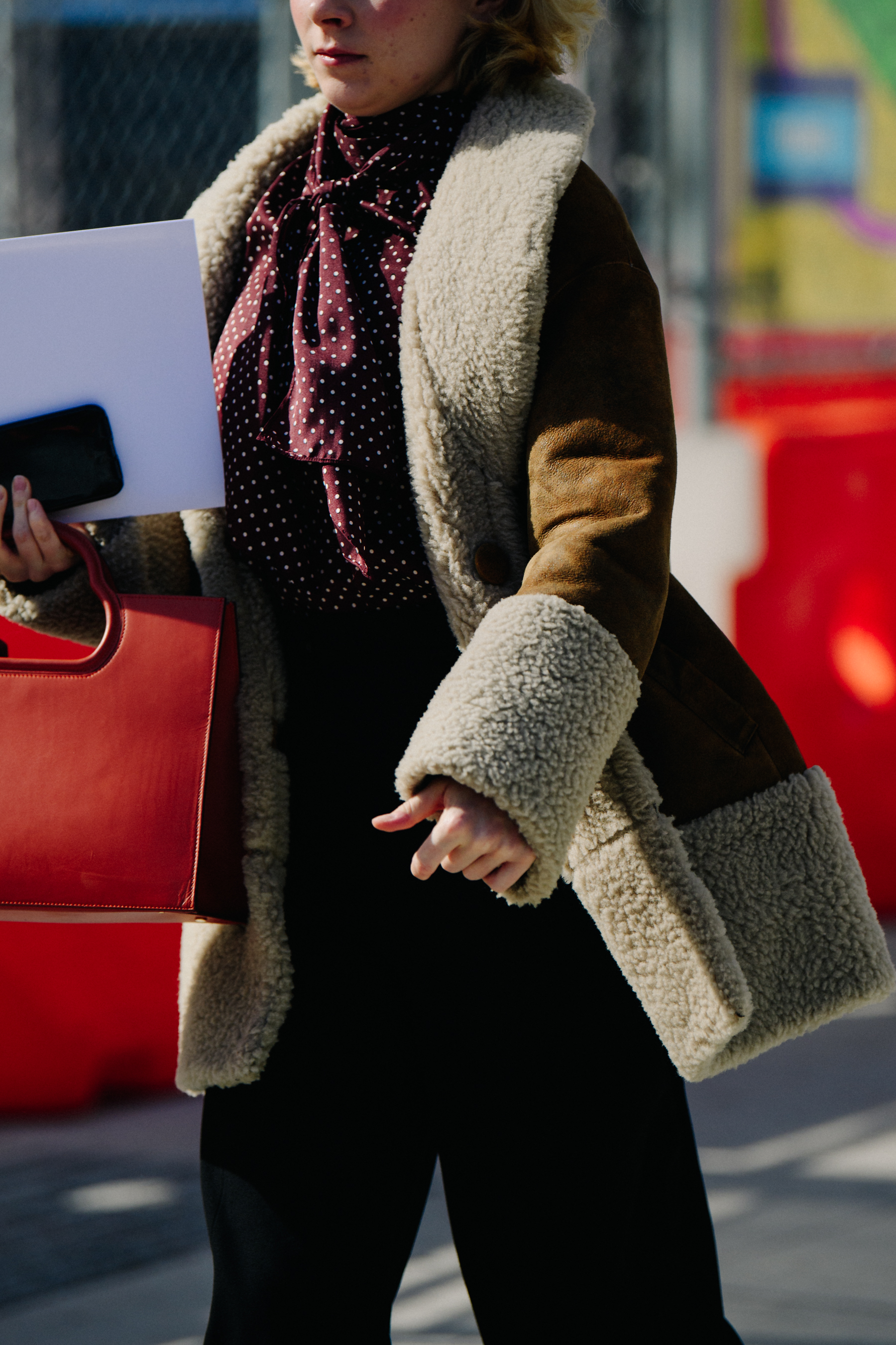Woman wearing brown shearling coat